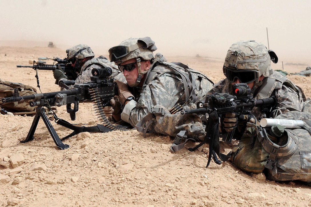 U.S. Army soldiers set up a perimeter for a joint training exercise with Iraqi Army soldiers on Camp Kassum, Al Asad Air Base, Iraq, June 22, 2010.