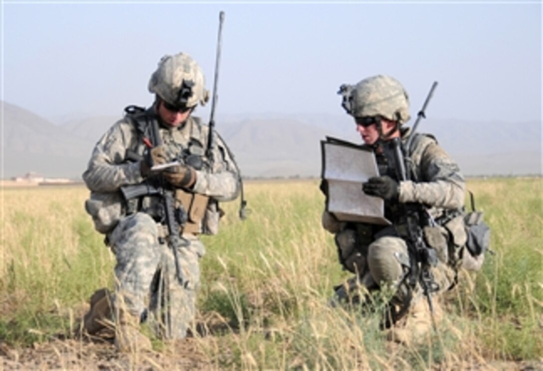 U.S. Army 1st Lt. Matthew Hilderbrand (left) and Staff Sgt. Kevin Sentieri, from 2nd Platoon, Delta Company, 1st Battalion, 4th Infantry Regiment, U.S. Army Europe, patrol across a plateau in search of a weapons cache outside Combat Outpost Sangar in Zabul province, Afghanistan, on June 27, 2010.  
