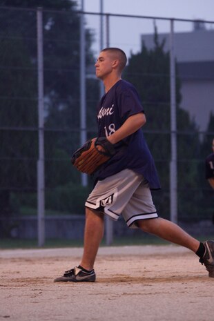 Bryan Broyle, pitcher for the Bad News Bears, steps up to pitch a softball during an intramural softball game at the main softball field here July 1. The Bad News Bears stay alert and ready for the hit.