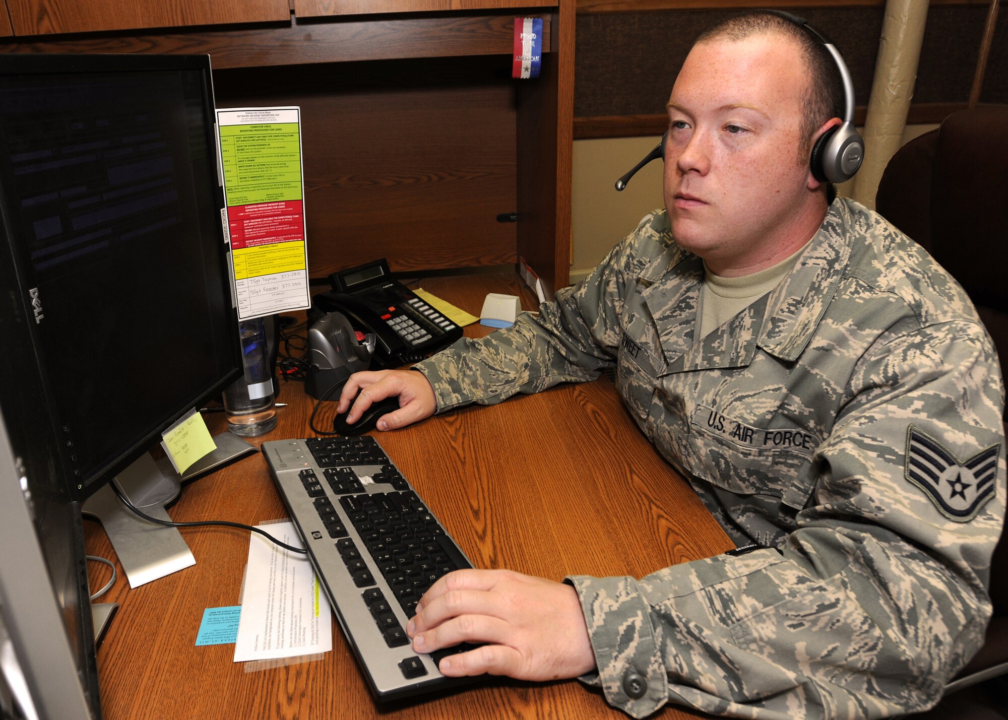 Staff Sgt. Jeremy Sweet helps troubleshoot a computer issue for a customer on June 2, 2010, Eielson Air Force Base, Alaska.  The Network Control Center is responsible for more than 2,200 computers on the base and for making sure that all network patches are up to date on each Airmen's computer on Eielson.  Sergeant Sweet is a Help Desk Technician with the 354th Communications Squadron.  (U.S. Air Force/Staff Sgt Tia Wilson)
