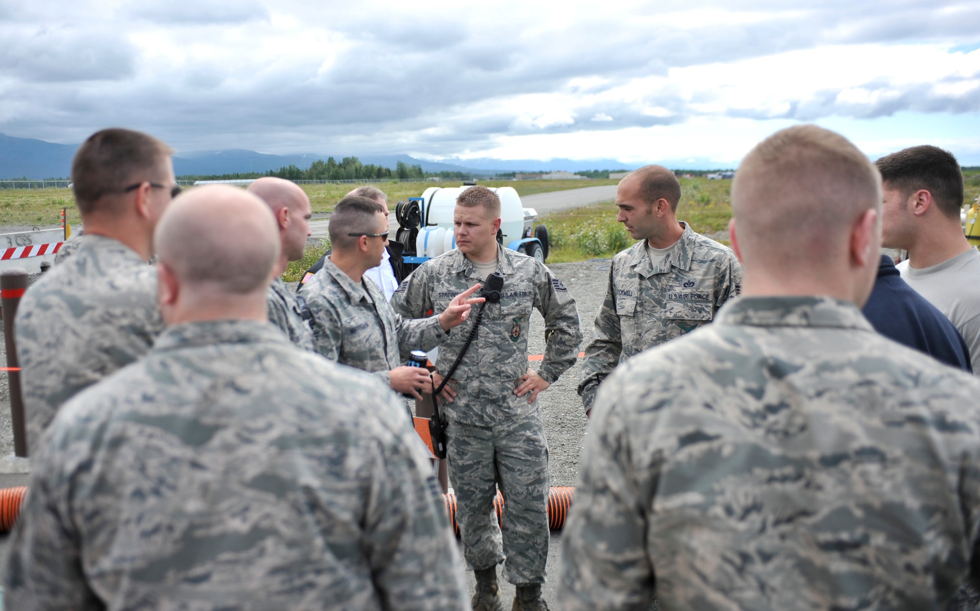 JOINT BASE ELMENDORF-RICHARDSON, Alaska – Tech. Sgt. Richard Matteson, Joint Base Elmendorf-Richardson Fire Department, A-Shift Battalion Chief, briefs his crew before they perform a confined space entry rescue drill June 30. JBER firefighters are required to be involved in this type of exercise annually. (Air Force photo by Airman 1st Class Christopher Gross)