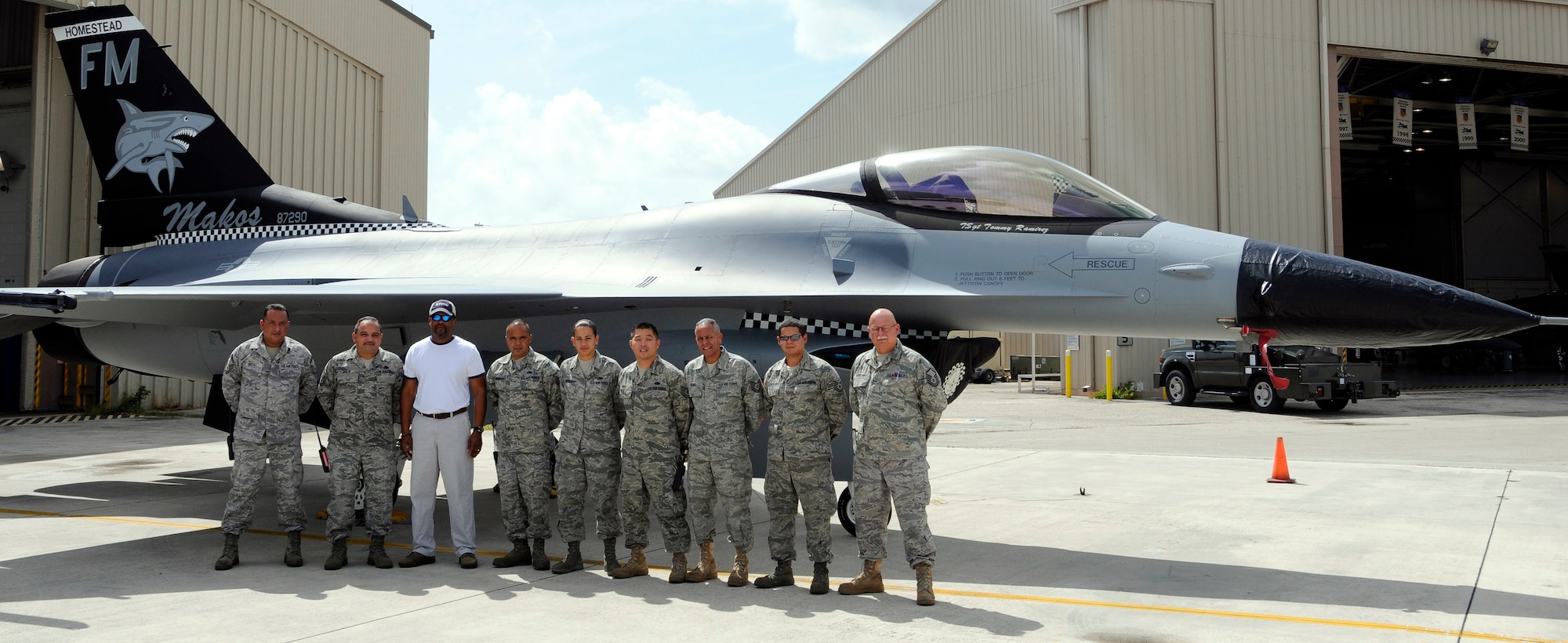 Personnel from the 482nd Maintenance Squadron Fabrication Section stand in front of aircraft number 209 after painting the distinctive tail art on June 29. The 482nd Fighter Wing “Mako’s” branded its image with distinguishable tail art for the wing’s flagship F-16 aircraft. The distinct aircraft markings are a first for Homestead Air Reserve Base and will serve as reminder of the strength, pride and perseverance of the 482nd FW. (U.S. Air Force photo/Senior Airman Lou Burton)