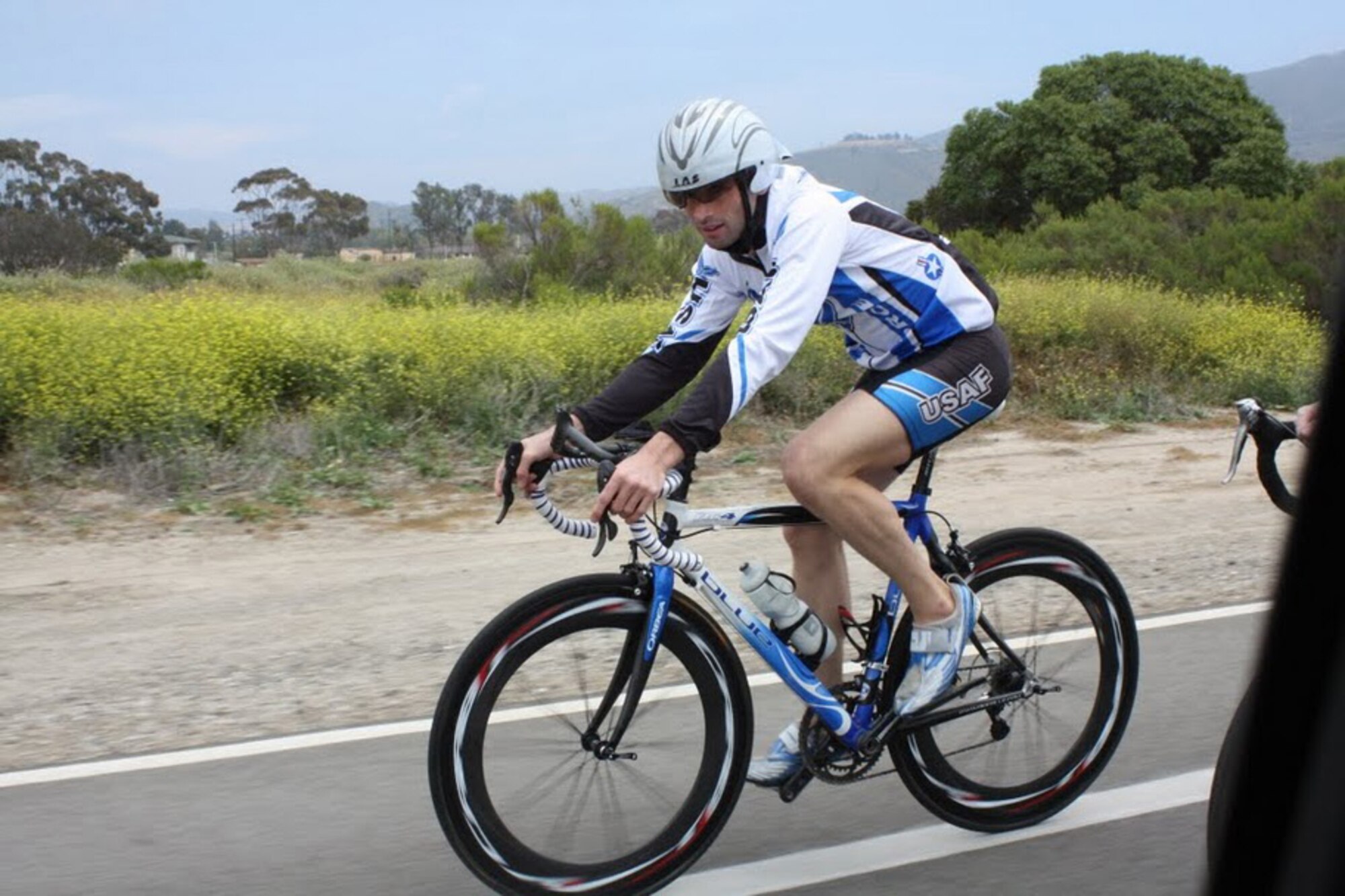 U.S. Air Force Capt. Ken Corigliano, 11th Intelligence Squadron, Detachment 2, rides his bicycle during the  2010 Armed Forces Triathlon Championship June 5, 2010. Captain Corigliano finished 12th overall. (Courtesy photo)
