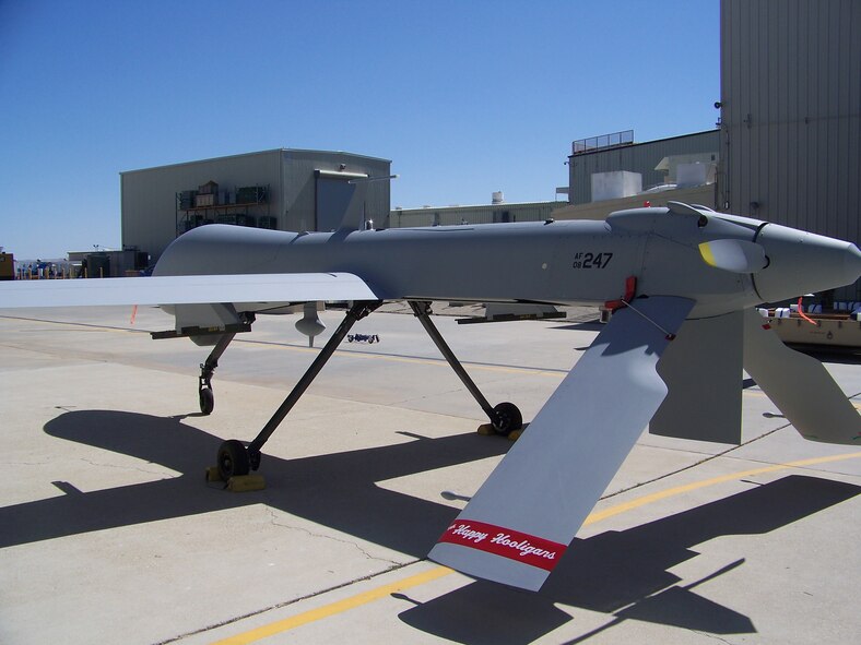 The North Dakota Air National Guard accepts its' first MQ-1 Predator aircraft at the General Atomics Aeronautical Systems Gray Butte facility in California, June 21. A sticker of the traditional Happy Hooligan tailflash is ceremoniously taped to the tail of the aircraft before it is crated for delivery. 