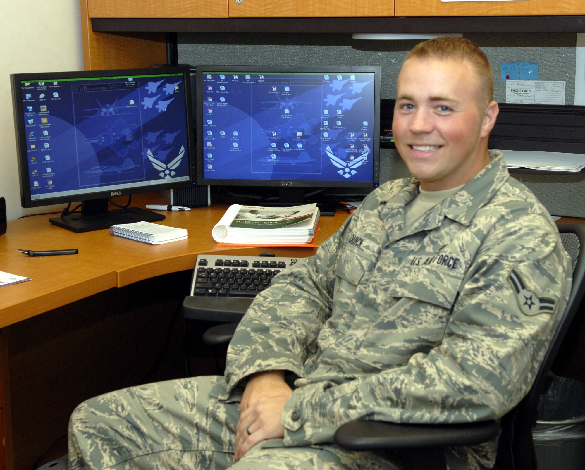 Airman 1st Class Robert Quick, 1st Special Operations Medical Operations Squadron mental health technician, poses in front of his desk at the behaviorial health clinic at Hurlburt Field, Fla., July 1, 2010. Airman Quick was selected for this week's "Tip of the Spear" spotlight. (DoD photo by U.S. Air Force Airman 1st Class Joe McFadden) (RELEASED)