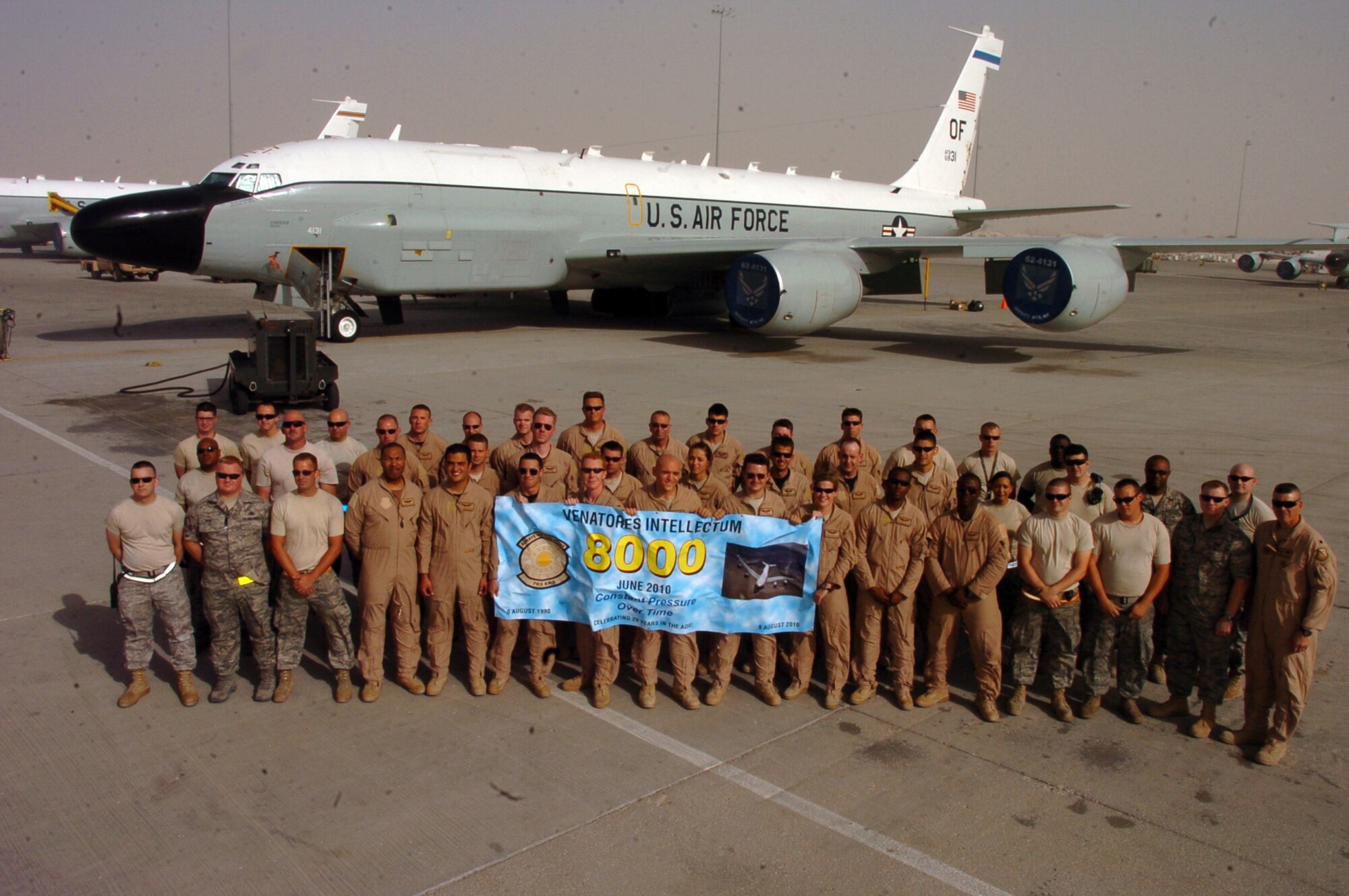 SOUTHWEST ASIA -- Members of the 763rd Expeditionary Reconnaissance Squadron pose for a photo after flying the unit's 8,000th mission in this area of responsibility June 25. This is just the latest achievement in the history of the unit.  The squadron will reach another milestone in August when it marks 20 continuous years in this AOR.  U.S. Air Force photo