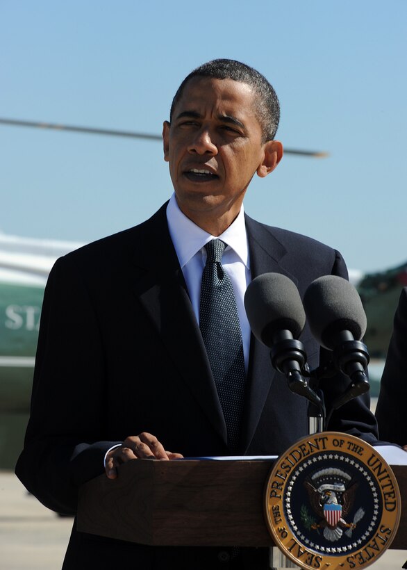 President Barack Obama addresses June employment reports on the flight line at Joint Base Andrews, Md., before heading to Charleston, W. Va. to attend the funeral of U.S Senator Robert C. Byrd July 2, 2010. (U.S. Air Force photo by Staff Sgt Melissa Stonecipher)