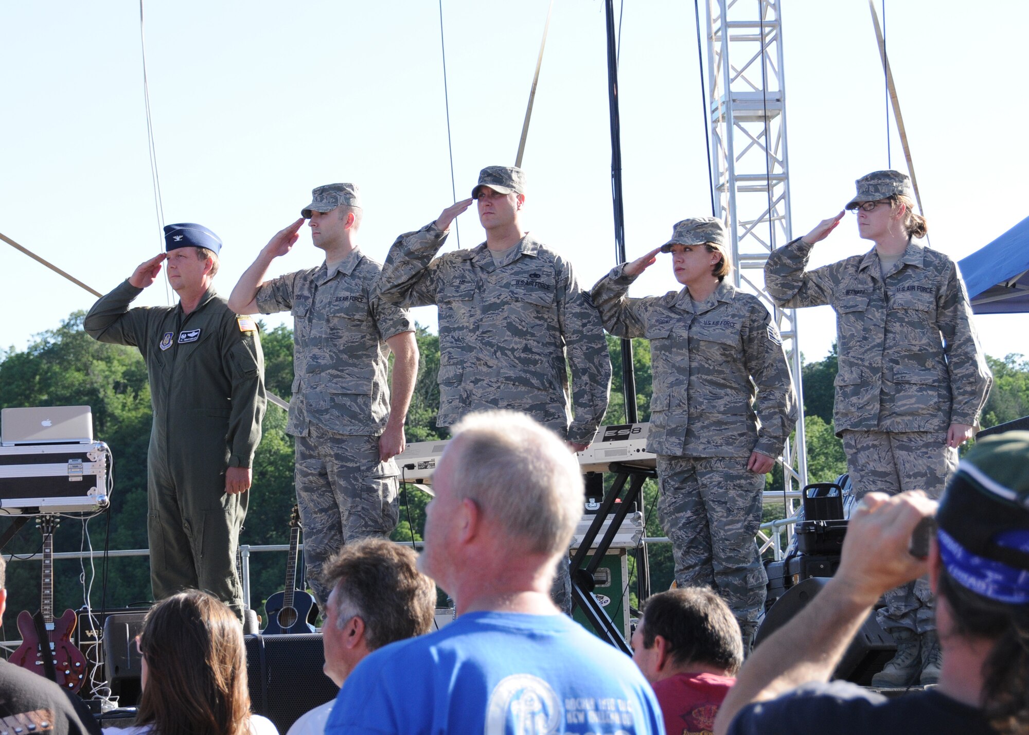 Members of the 914th Airlift Wing are recognized during a community awareness initiative event, June 29, Artpark, Lewiston NY. Col. Al Swartzmiller, the Niagara Falls Air Base Honor Guard was on stage with four recently deployed Airmen while Technical Sgt. Joel Laureano sang the nation anthem. The event featured performances by Grand Island native Stacy Clark and the band America. (U.S. Air Force photo by Staff Sgt. Joseph McKee)