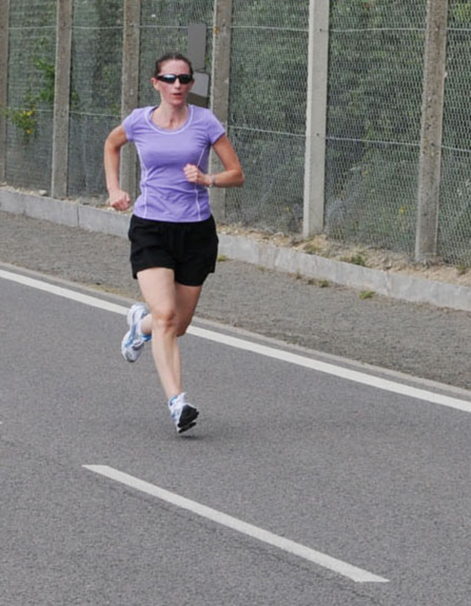 RAF MILDENHALL, England -- Karen Brown, 100th Air Refueling Wing Public Affairs, was the only Ministry of Defence civilian participating in a 100th ARW 5K fun run June 25. She joined her military coworkers and other members of RAF Mildenhall for the monthly event, which aims to promote health and fitness. (U.S. Air Force photo by Karen Abeyasekere)