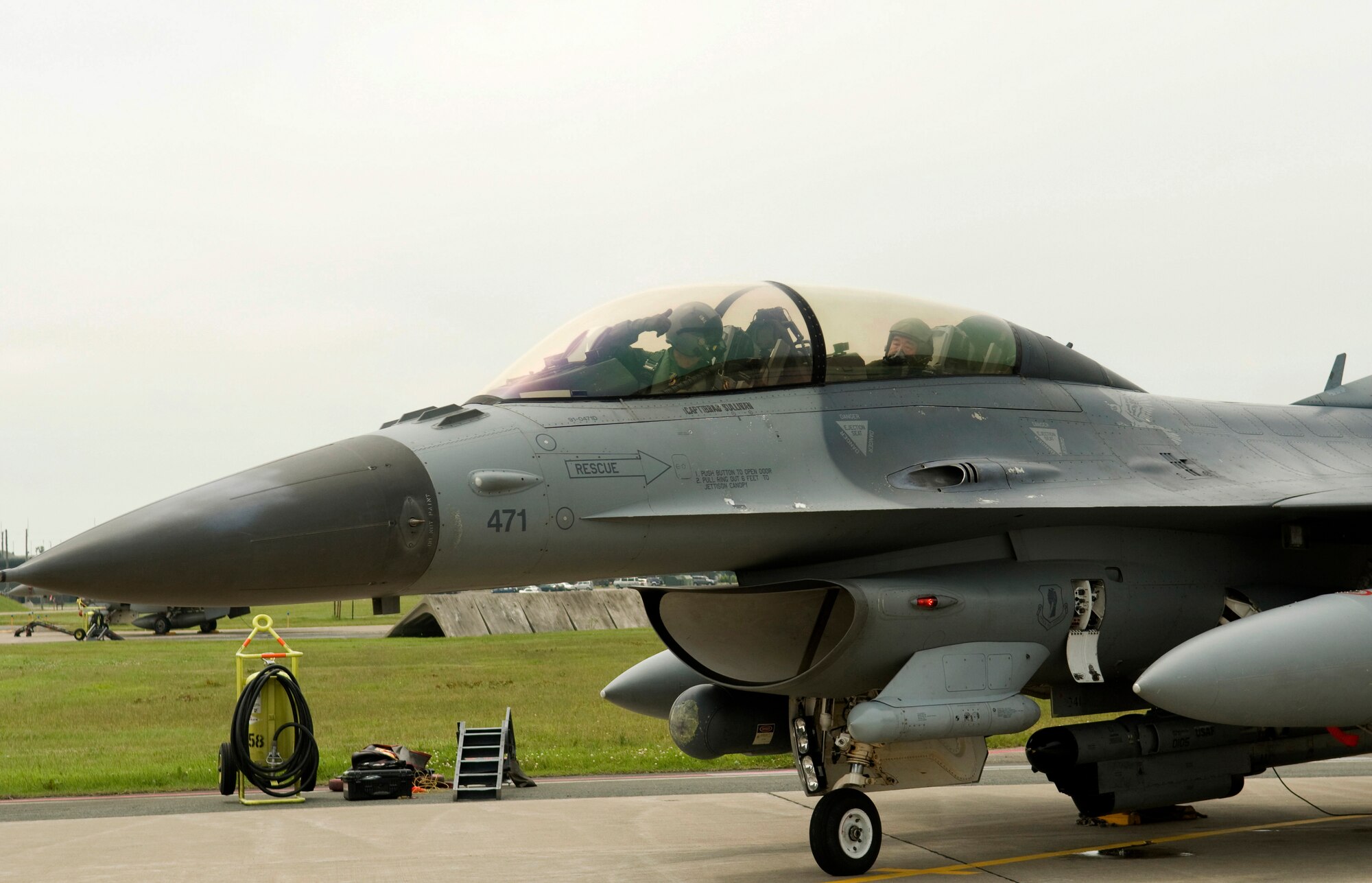MISAWA AIR BASE, Japan -- Col. David Stilwell, 35th Fighter Wing commander, ensures Kazumasa Taneichi, Misawa City mayor and honorary commander for the day, is ready to taxi, July 2. Once ready, the two taxied down Misawa?s flightline.  (U.S. Air Force photo/1st Lt. Jeff M. Nagan)