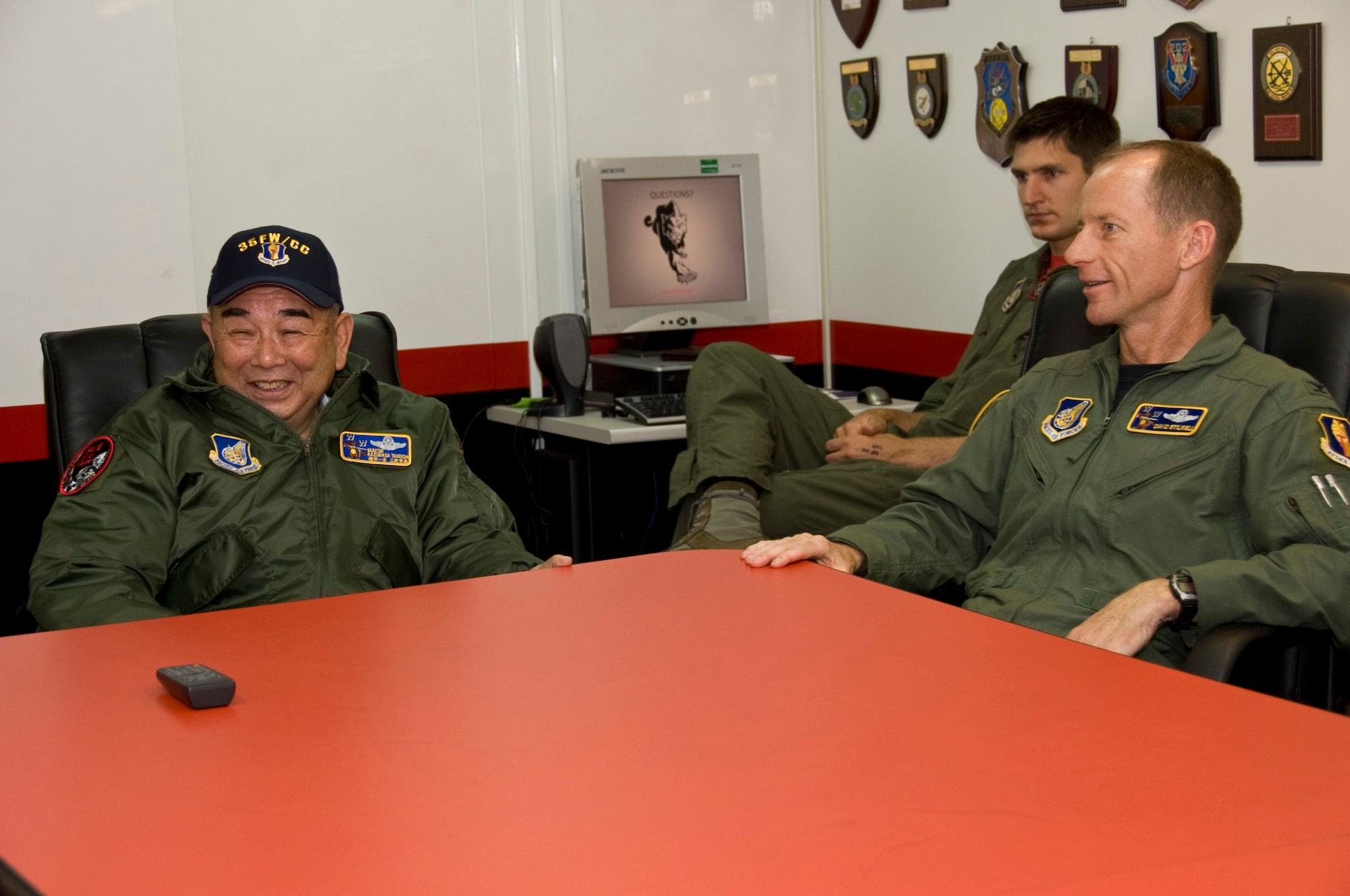 MISAWA AIR BASE, Japan -- As the honorary wing commander for the day, Misawa City Mayor Kazumasa Taneichi and Col. David Stilwell, 35th Fighter Wing commander, receive a misson brief prior to leaving the 13th Fighter Squadron, July 2. Mayor Taneichi experience some of what a pilot does prior to flight. (U.S. Air Force photo/ Staff Sgt. Araceli Alarcon)
