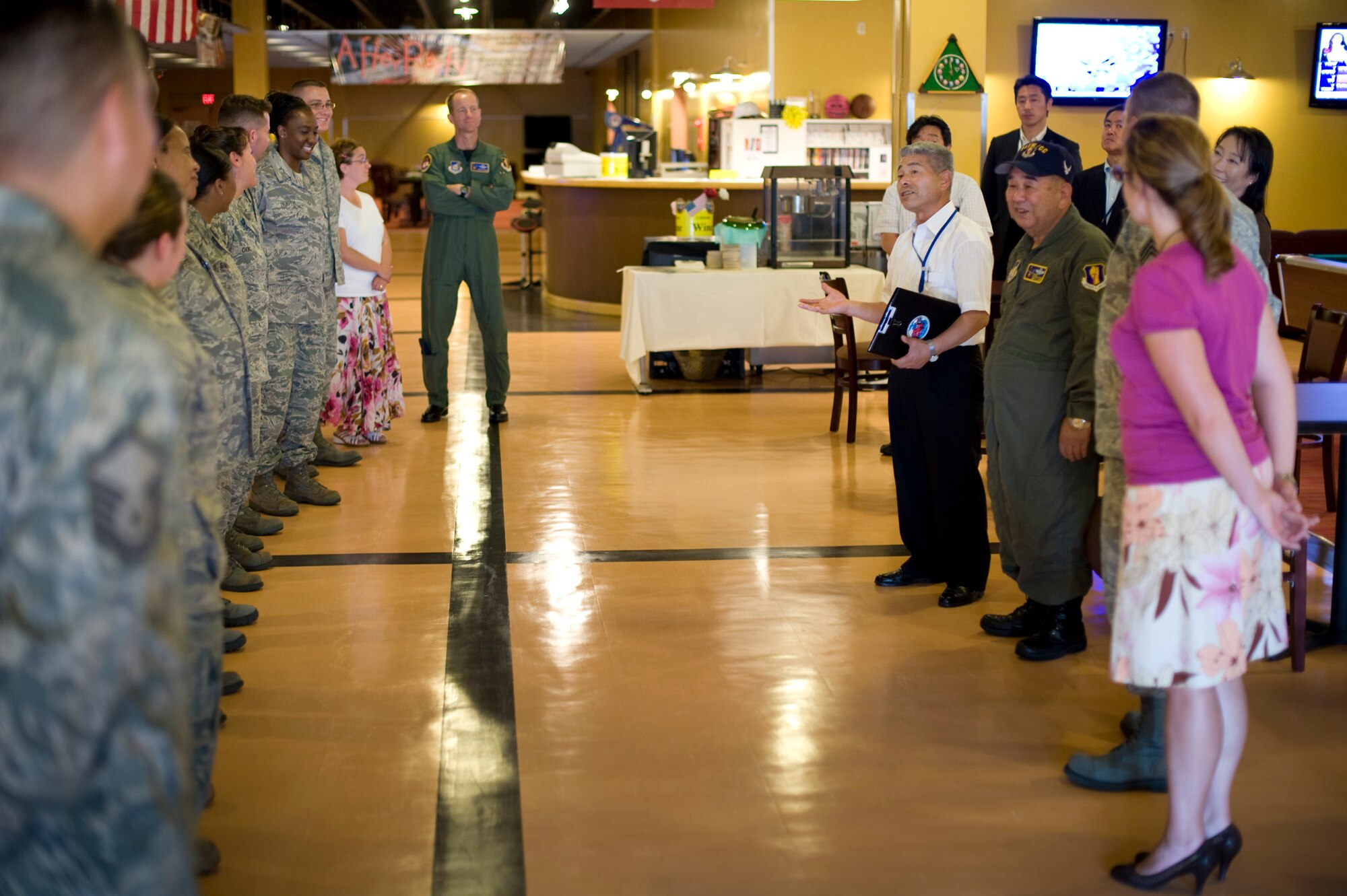 MISAWA AIR BASE, Japan -- Staff Sgt. Jonathan Strom, Airmen Against Drunk Driving president and First Term Airman's Center instructor, bows as he introduces himself to Kazumasa Taneichi, Misawa City mayor and honorary commander of the 35th Fighter Wing for the day, July 2. The Enlisted Leadership Council asked Mayor Taneichi questions about how they could further improve relations with the local community. (U.S. Air Force photo/Staff Sgt. Samuel Morse)