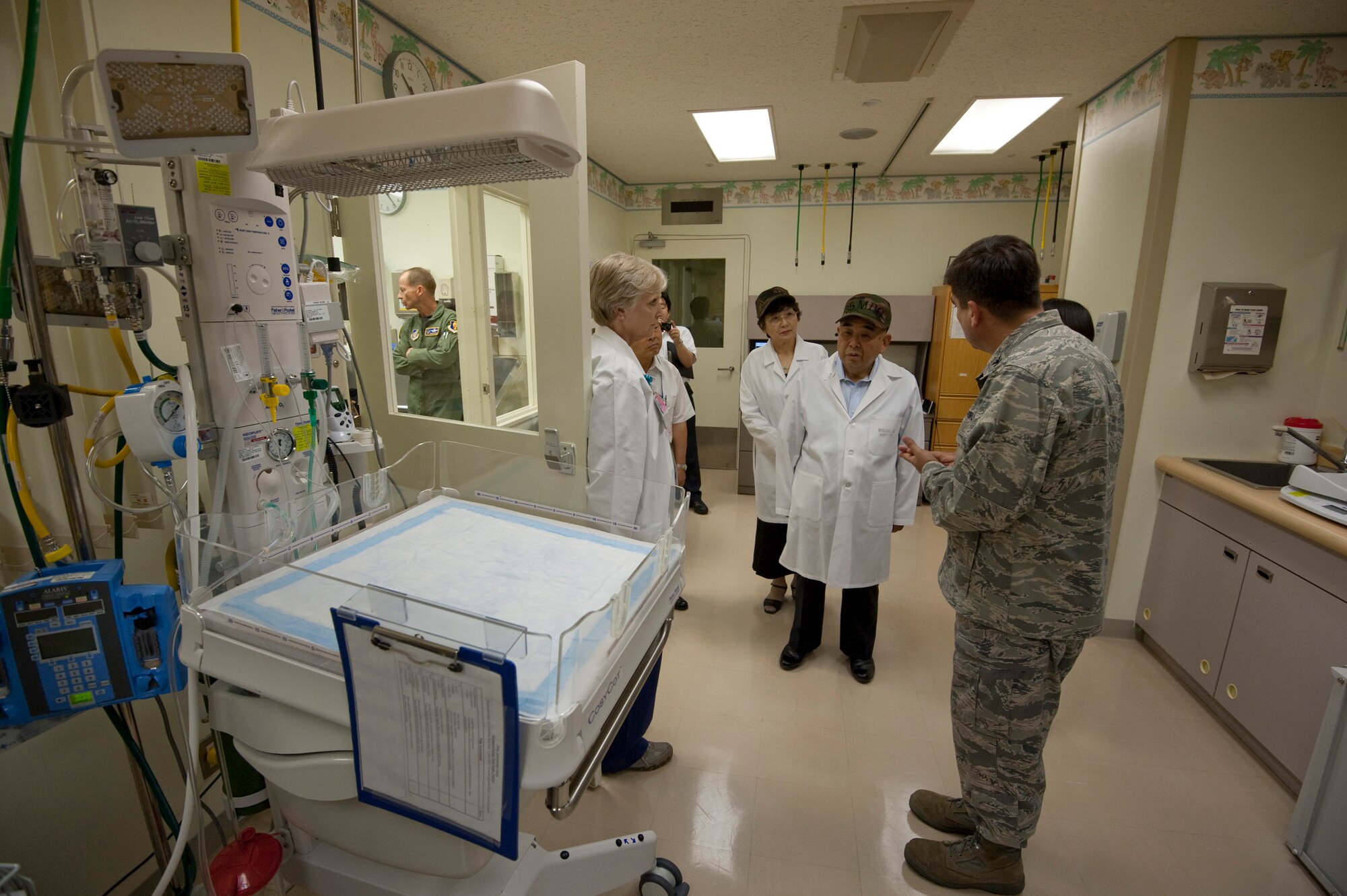 MISAWA AIR BASE, Japan -- Col. Guillermo Tellez, 35th Medical Group commander, shows Kazumasa Taneichi, Misawa City mayor and honorary commander of the 35th Fighter Wing for the day, the labor and delivery ward, July 2, at the 35th MDG Hospital. Mayor Taneichi was surprised to hear that the 35th MDG delivers about 30 babies in a typical month. (U.S. Air Force photo/Staff Sgt. Samuel Morse)