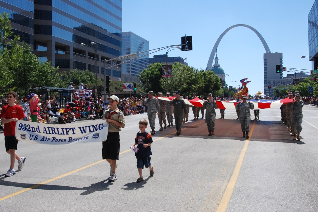 Air Force Reserve Command (AFRC) reservists from the 932nd Airlift Wing helped Saint Louis celebrate Independence Day by marching the American flag in the Veiled Prophet parade July 3, 2010.  The 932nd is the only AFRC Illinois flying unit flying the distinguished visitor mission aboard both C-9C and C-40C planes.  (U.S. Air Force photo/Maj. Stan Paregien)