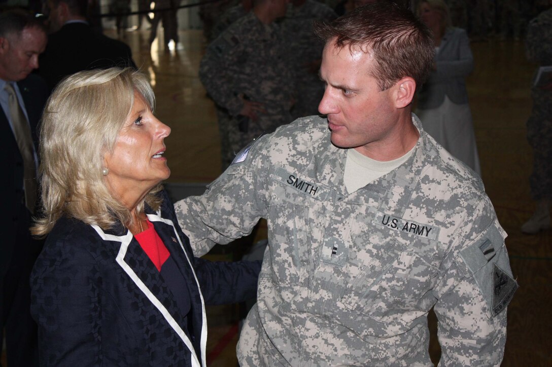 Dr. Jill Biden, wife of Vice President Joe Biden, greets a soldier at a sports facility on Camp Victory, Iraq, July 4, 2010. 