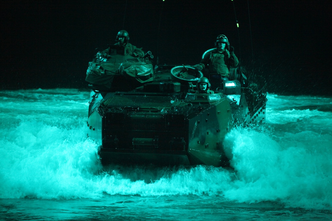 U.S. Marines with 4th Platoon, Company C, 3d Assault Amphibian Battalion, 1st Marine Division, return to the amphibious transport dock USS New Orleans (LPD18) after spending their 4th of July repairing the transmission of a Amphibious Assault Vehicle on a beach in Ancon, Peru. The unit is embarked on the transport dock ship USS New Orleans (LPD 18)  in support of operation Partnership of the Americas/Southern Exchange, a combined amphibious exercise designed to enhance cooperative partnerships with maritime forces from Argentina, Mexico, Peru, Brazil, Uruguay, and Colombia.   (U.S. Marine Photo photo by Cpl Brian J. Slaght/Released)::r::::n::