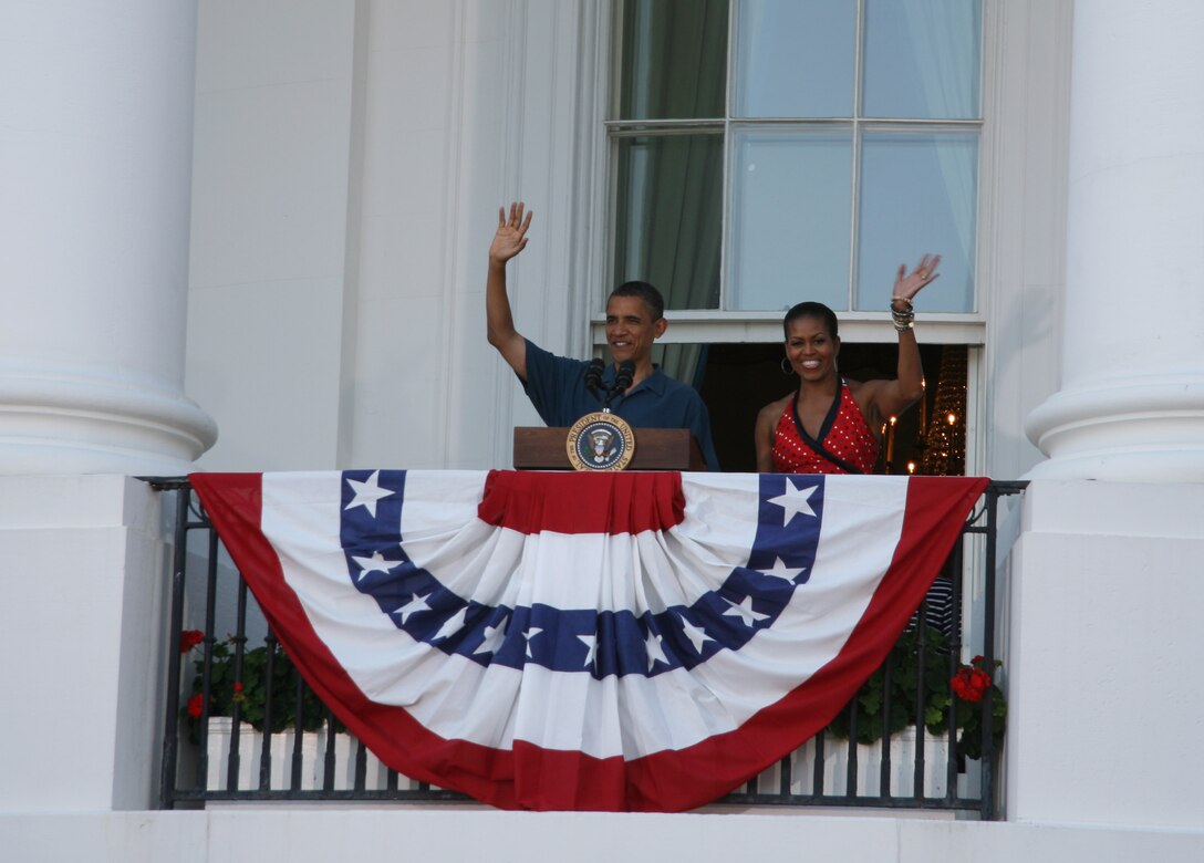 President Barack Obama and First Lady Michelle Obama wave to 1,200 service members and their families who celebrated Independence Day 2010 on the south lawn of the White House.  The first family invited the guests to celebrate the second annual “Salute to the military” event as a way to show their appreciation for the sacrifices men and women in uniform and their families, make for their country.