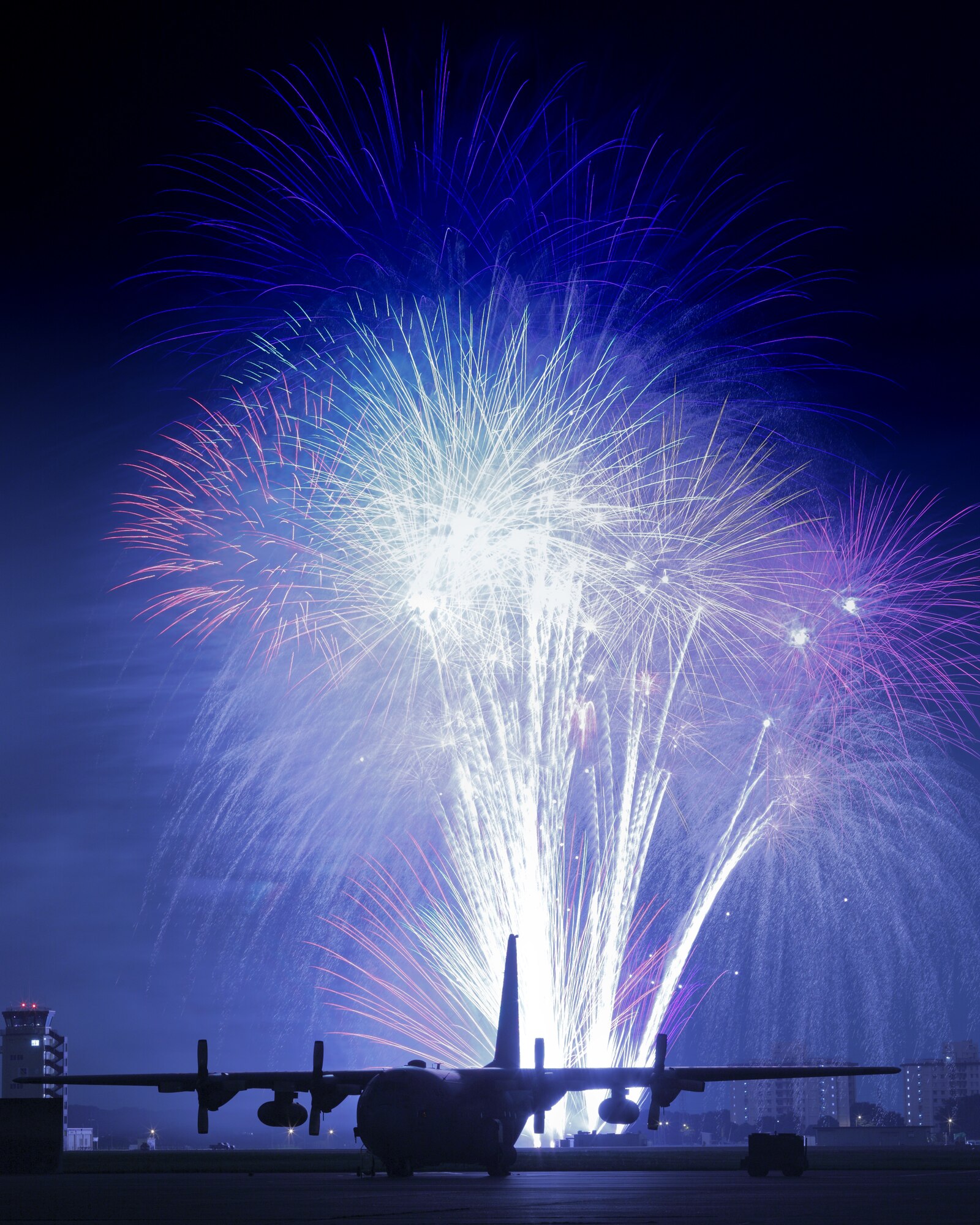 YOKOTA AIR BASE, Japan -- Fireworks burst over Yokota Air Base July 3. The 374th Force Support Squadron provided Yokota residents and their guests with events for all ages. The day kicked off with the Firecracker 5K run and a wide variety of activities throughout the day to include go-carts, petting zoo, live entertainment, food and fireworks. (U.S. Air Force photo/Osakabe Yasuo)