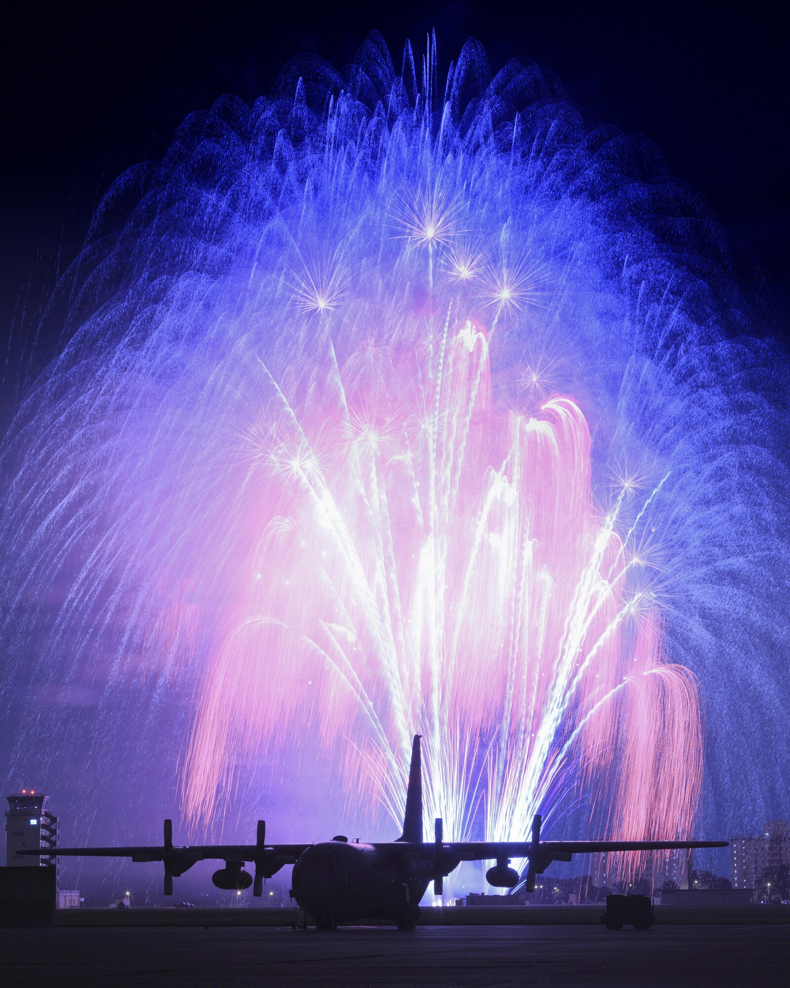 YOKOTA AIR BASE, Japan -- Fireworks burst over Yokota Air Base July 3. The 374th Force Support Squadron provided Yokota residents and their guests with events for all ages. The day kicked off with the Firecracker 5K run and a wide variety of activities throughout the day to include go-carts, petting zoo, live entertainment, food and fireworks. (U.S. Air Force photo/Osakabe Yasuo)