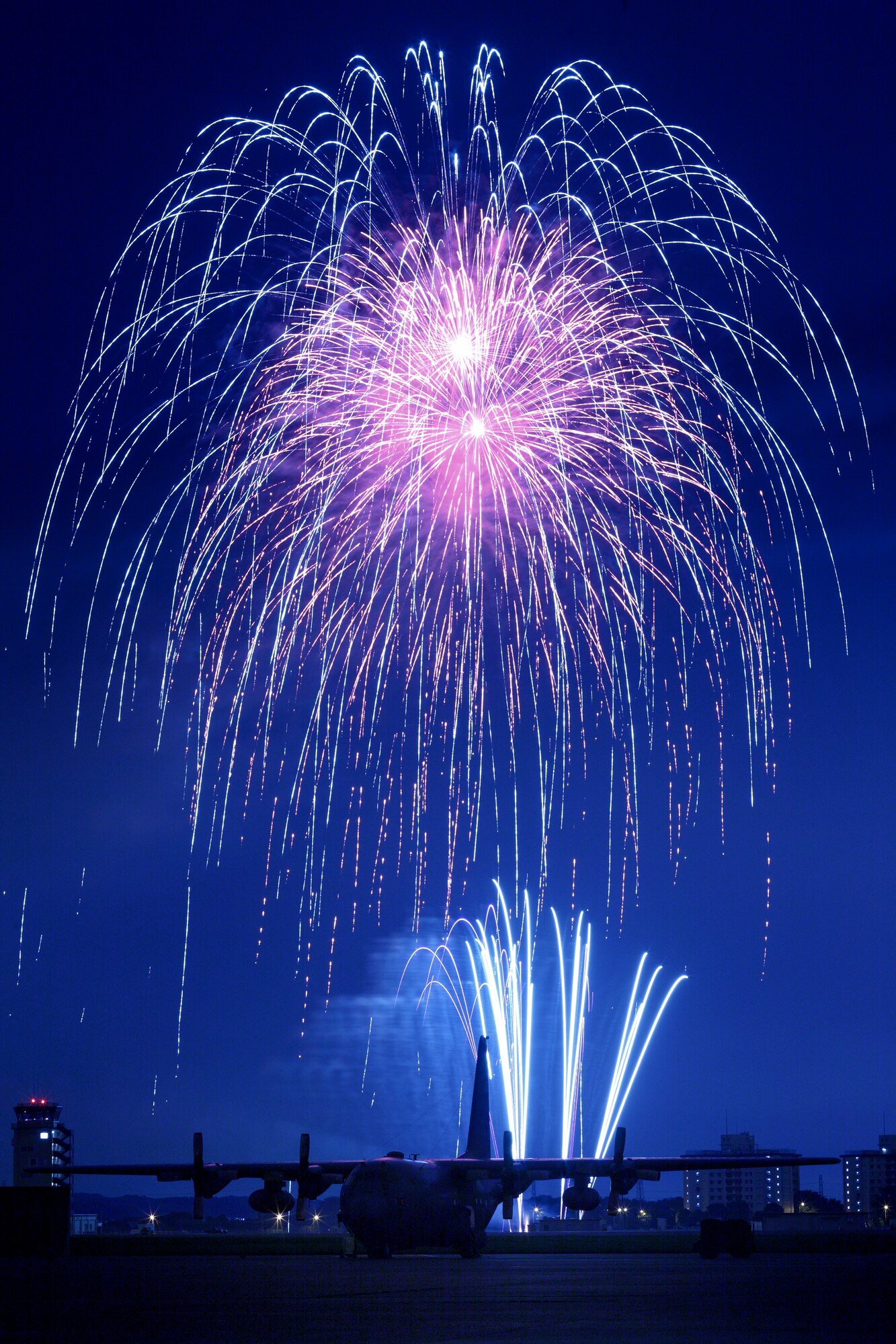 YOKOTA AIR BASE, Japan -- Fireworks burst over Yokota Air Base July 3. The 374th Force Support Squadron provided Yokota residents and their guests with events for all ages. The day kicked off with the Firecracker 5K run and a wide variety of activities throughout the day to include go-carts, petting zoo, live entertainment, food and fireworks. (U.S. Air Force photo/Osakabe Yasuo)