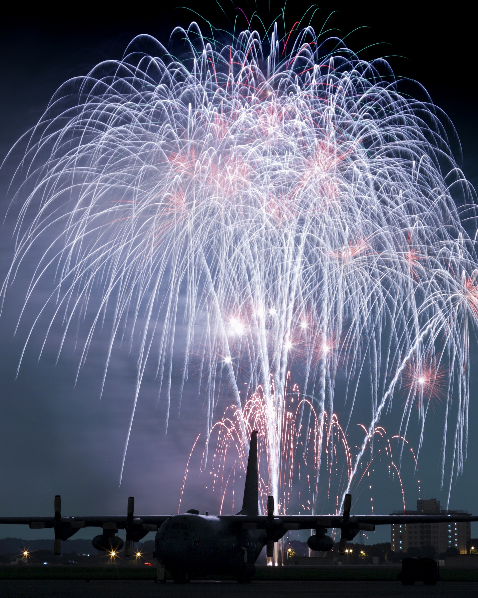 YOKOTA AIR BASE, Japan -- Fireworks burst over Yokota Air Base July 3. The 374th Force Support Squadron provided Yokota residents and their guests with events for all ages. The day kicked off with the Firecracker 5K run and a wide variety of activities throughout the day to include go-carts, petting zoo, live entertainment, food and fireworks. (U.S. Air Force photo/Osakabe Yasuo)