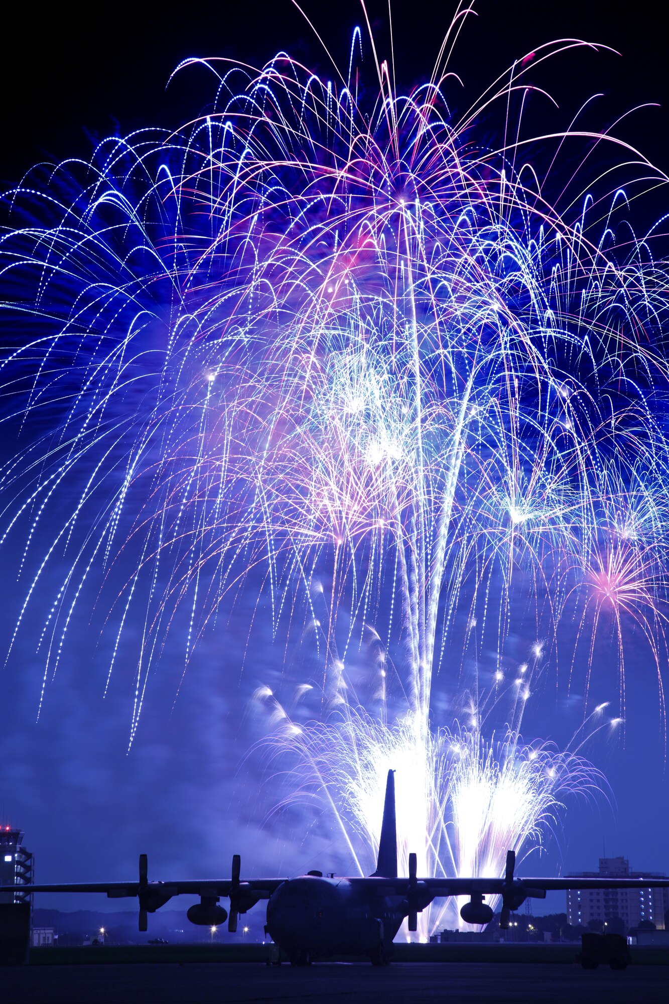 YOKOTA AIR BASE, Japan -- Fireworks burst over Yokota Air Base July 3. The 374th Force Support Squadron provided Yokota residents and their guests with events for all ages. The day kicked off with the Firecracker 5K run and a wide variety of activities throughout the day to include go-carts, petting zoo, live entertainment, food and fireworks. (U.S. Air Force photo/Osakabe Yasuo)