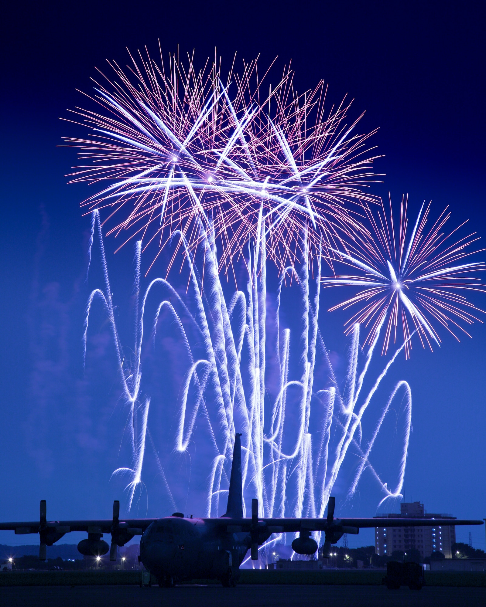 YOKOTA AIR BASE, Japan -- Fireworks burst over Yokota Air Base July 3. The 374th Force Support Squadron provided Yokota residents and their guests with events for all ages. The day kicked off with the Firecracker 5K run and a wide variety of activities throughout the day to include go-carts, petting zoo, live entertainment, food and fireworks. (U.S. Air Force photo/Osakabe Yasuo)
