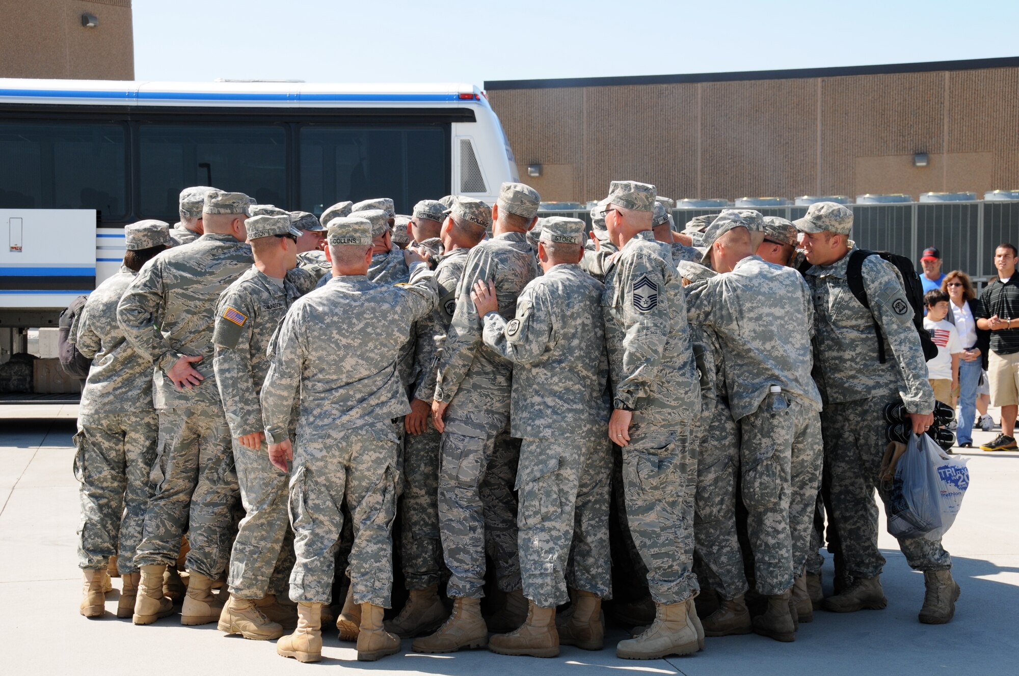 The Iowa National Guard's 734th Agri-Business Development Team "brings it in" at the conclusion of the Team's Community Send-Off Ceremony on July 1 at Camp Dodge, Iowa. USAF Photo Capt. Peter Shinn, 734th ADT Public Affairs (Released)