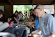 Family, friends and members of the 734th Agri-Business Development Team enjoy the meal provided by Iowa ag producer groups and food companies at the June 30 Family Send-Off Picnic for the Team. USAF Photo Capt. Peter Shinn, 734th ADT Public Affairs (Released)