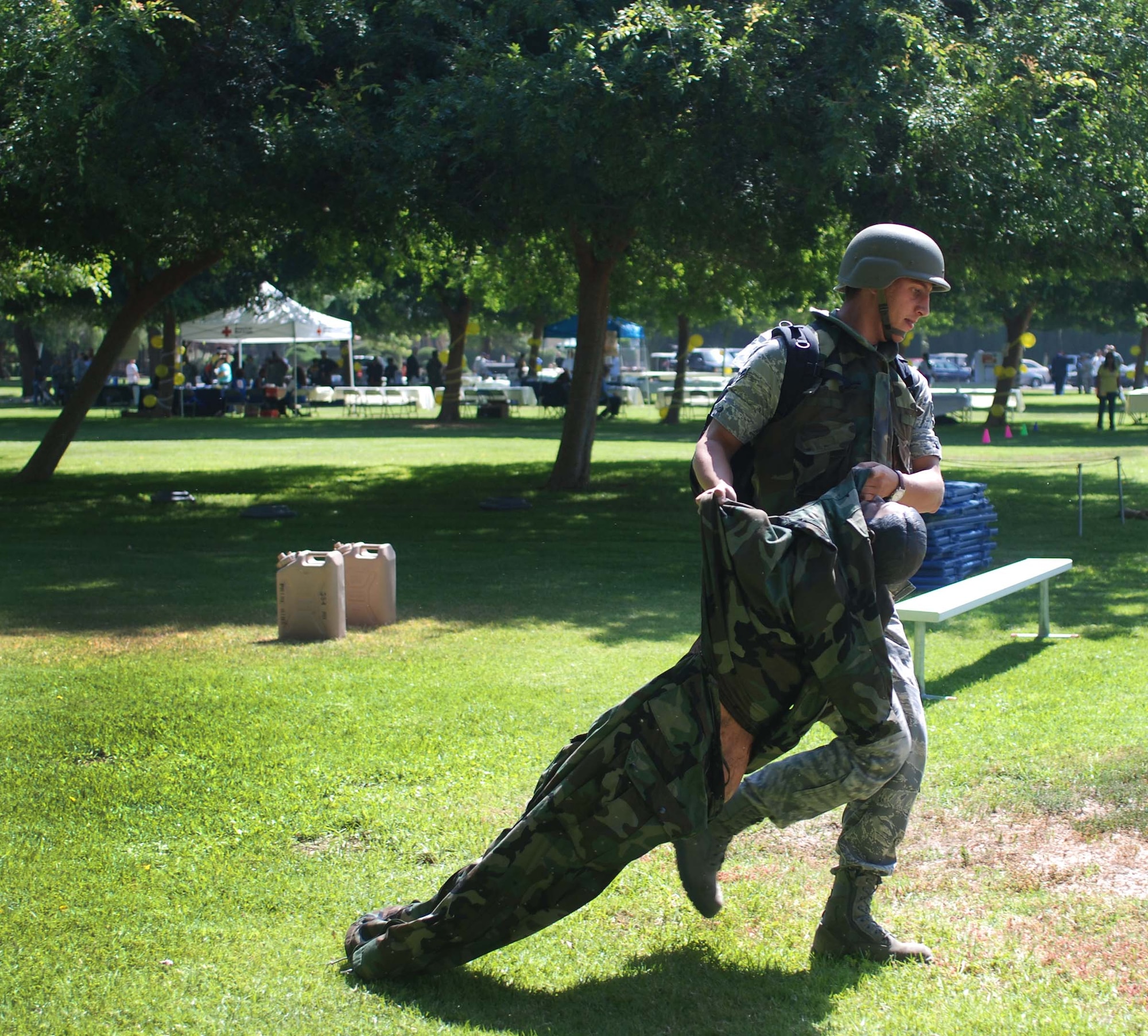 Airman 1st Class Chris Barnes, 119th North Dakota Air National Guard, who was at March for training, drags a mannequin during the combat obstacle course. He finished in 57 seconds. (U.S. Air Force photo by Megan Just)