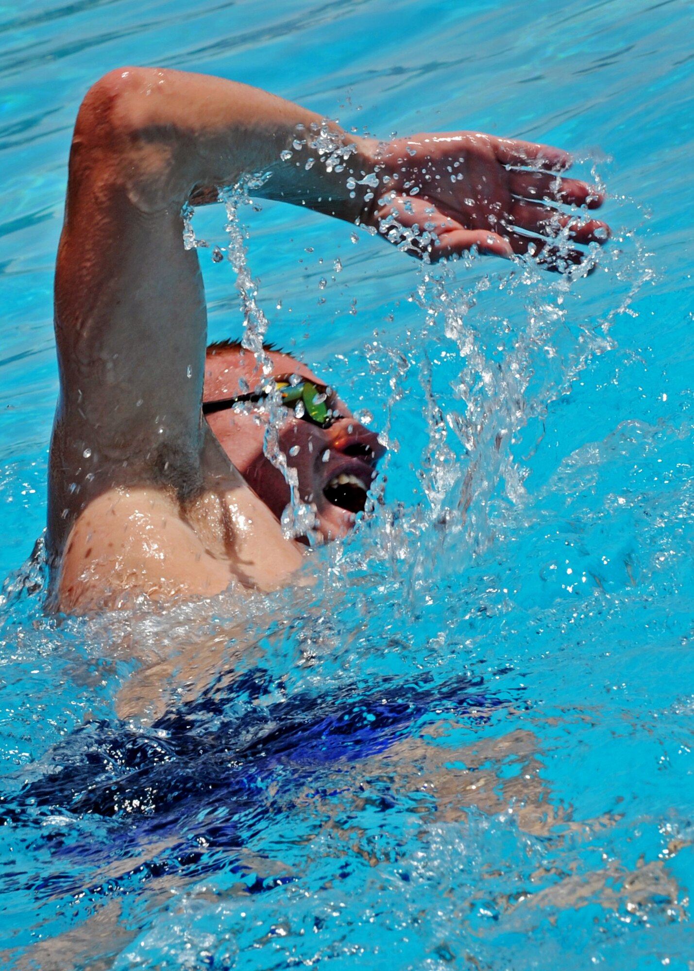 SOUTHWEST ASIA - Staff Sgt. Zachary Petroelje, 386th Expeditionary Maintenance Squadron munitions conventional maintenance supervisor, competes in the 500-meter free-style at an undisclosed air base here July 4, 2010. Sergeant Petroelje beat out four other swimmers to win with a time of 0:9:30. The event was part of Independence Day celebrations that included a variety of games for Airmen assigned to the 386th Air Expeditionary Wing. (U.S. Air Force photo by Senior Airman Laura Turner)