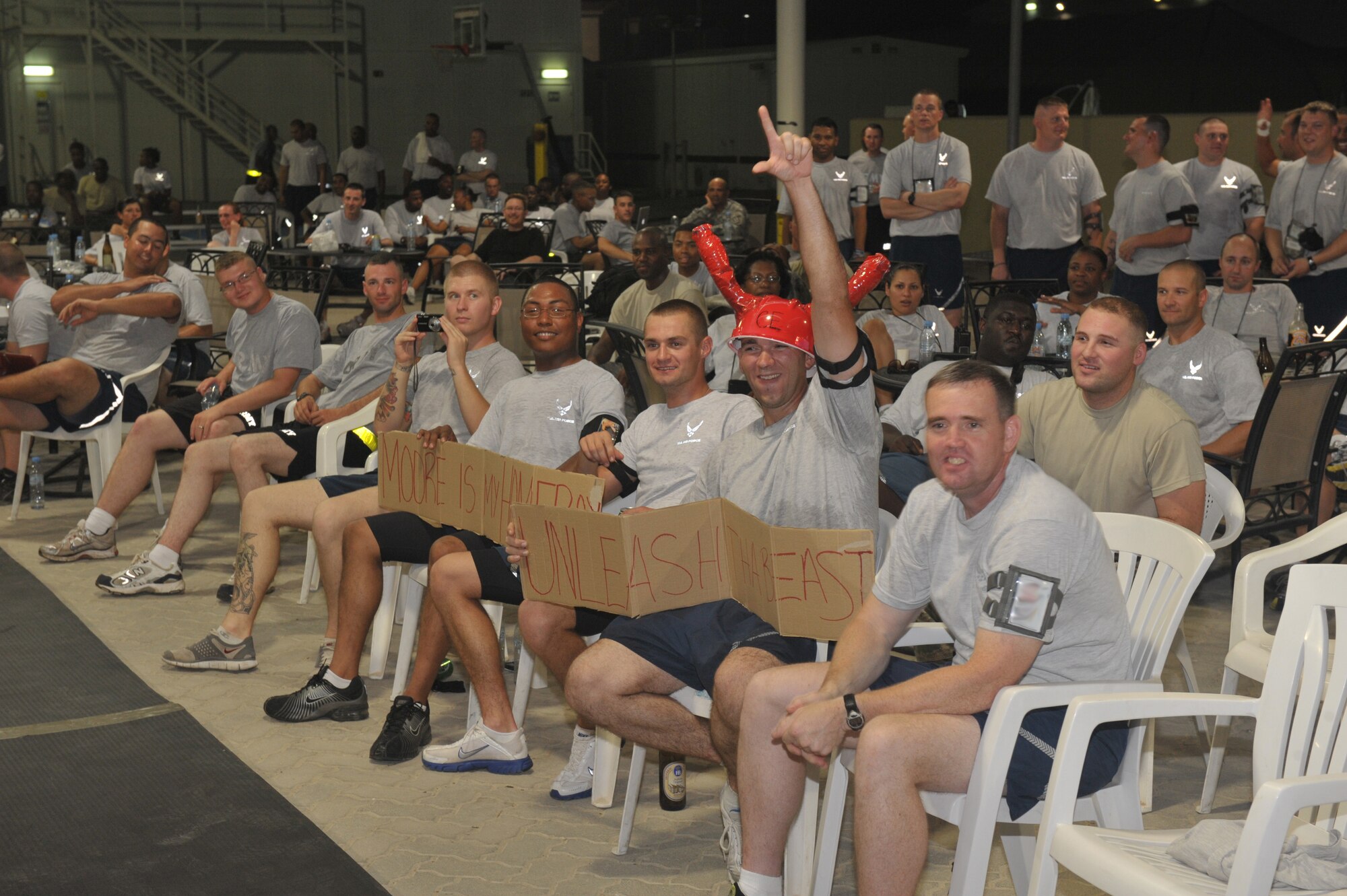 Crowd members cheer on their favorite boxer during the fight night event July 4 at an undisclosed location in Southwest Asia. The event capped off a full day of events celebrating Independence Day here. (U.S. Air Force photo/Staff Sgt Jeremy Larlee)