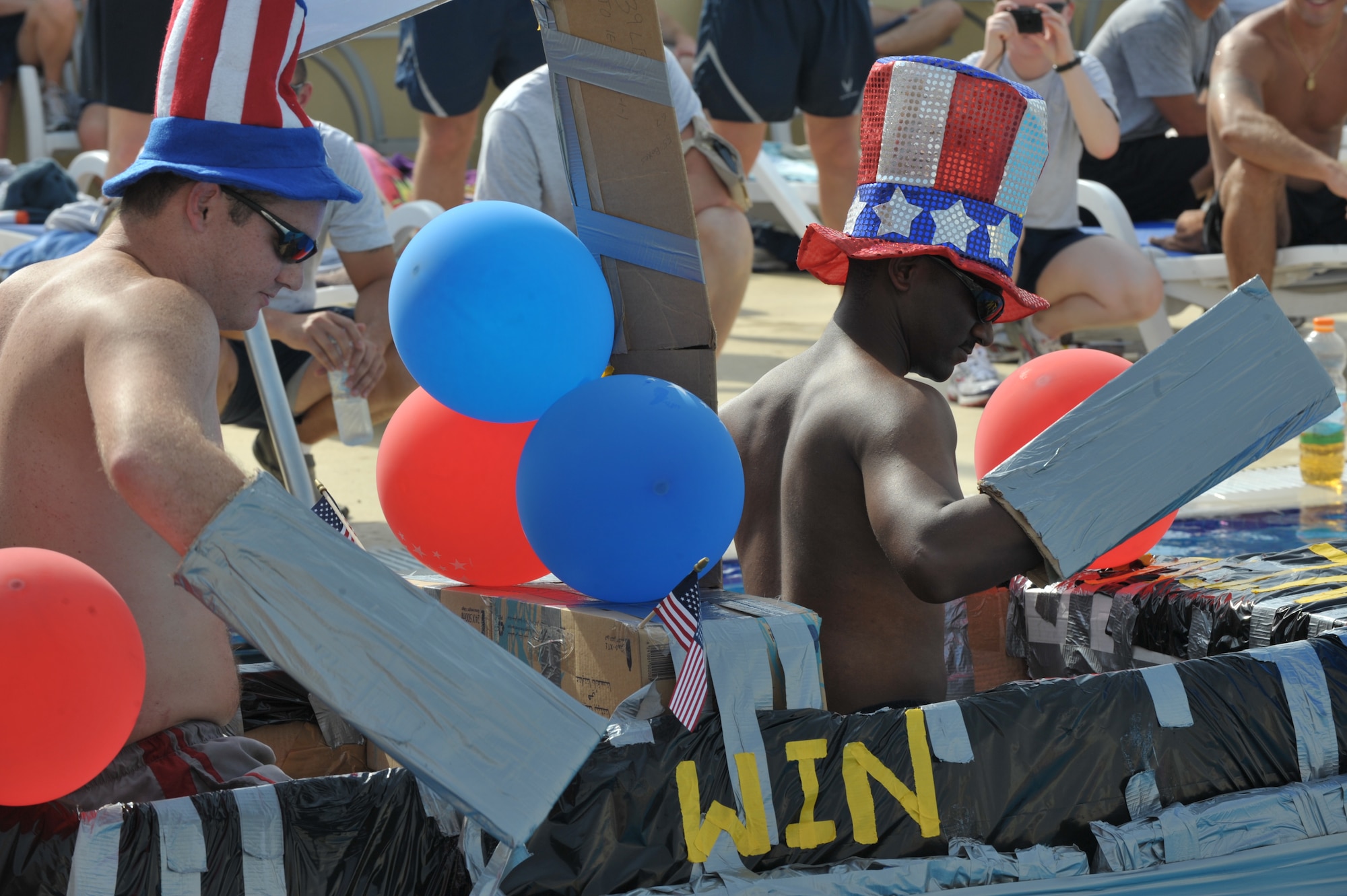Team Texas guides their water craft during the boat race July 4 at an undisclosed location in Southwest Asia. Team Texas took first place in the event. (U.S. Air Force photo/Tech. Sgt April Wickes)