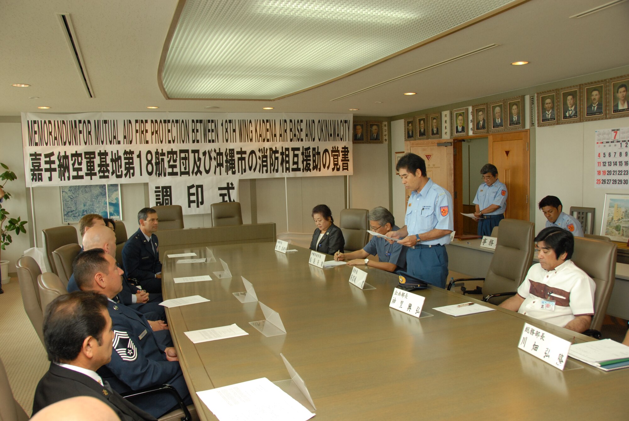 Hiroshi Takamiyagi, Okinawa City fire chief, delivers remarks at a signing ceremony for a memorandum of understanding to formalize cooperation between the Kadena Air Base and Okinawa City fire departments July 2, 2010 at the Okinawa City mayor's office. The MOU establishes a framework for mutual aid in the case of fire emergencies. (U.S. Air Force photo/Junko Kinjo)