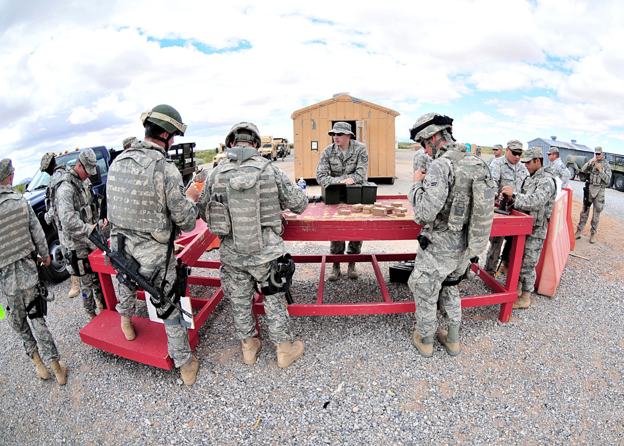 A team of Airmen prepare for a convoy live fire exercise during the U.S. Air Force's Desert Defender area security operations course June 30, 2010, on Fort Bliss, Texas. The six-week course is run by the Texas Air National Guard's 204th Security Forces Squadron. It prepares Air Force security forces Airmen for area security operations in Iraq and Afghanistan. Airmen deploy after graduation. (U.S. Air Force photo/Master Sgt. Mike R. Smith)