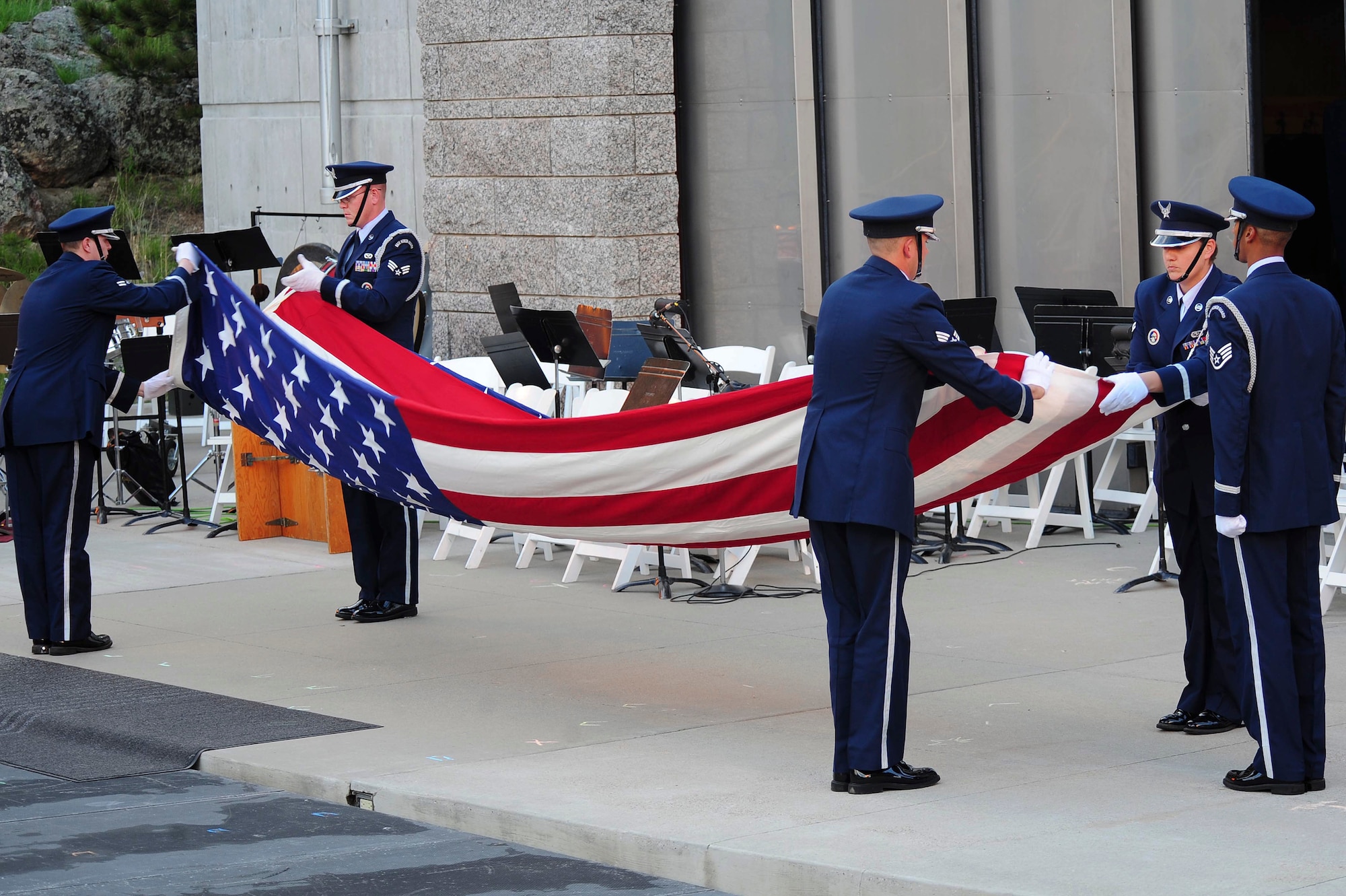 ELLSWORTH AIR FORCE BASE, S.D. – Members of the Ellsworth Honor Guard perform a flag folding ceremony in recognition of Ola Mildred Rexroat during the 2010 Independence Day celebration at Mt. Rushmore National Memorial, July 3. Mrs. Rexroat received the Congressional Gold Medal on March 10 for her military service. (U.S. Air Force Photo/Airman 1st Class Corey Hook)