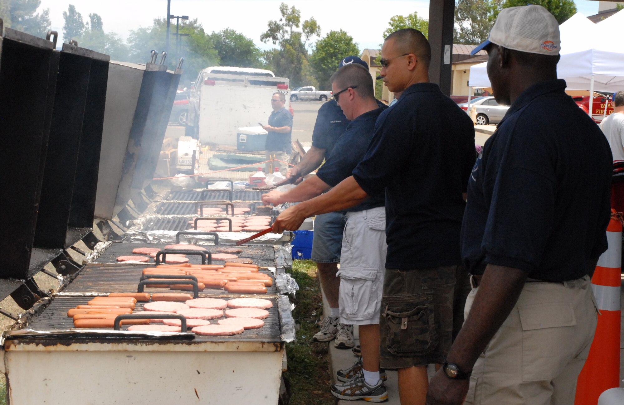Chief Master Sgt. Jason Henderson, 940th Wing Command Chief, works his magic on the grill. (U.S. Air Force Photo/A1C Adam Hamar)