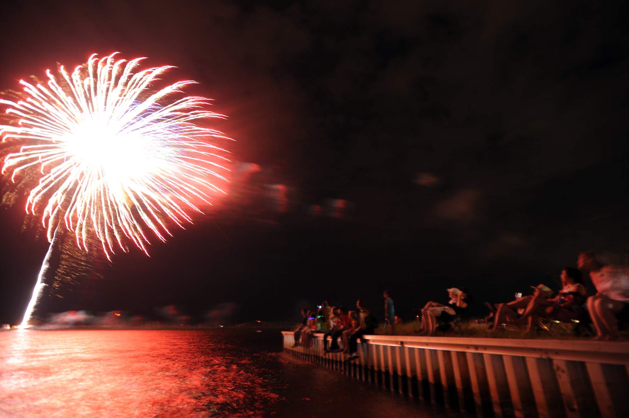 Hurlburt Airmen and families are treated to a dazzling 20-minute fireworks display during the 15th annual Sound of Independence at Hurlburt Field, Fla., July 2, 2010.  The festival, held every year at the Soundside Marina, features a cardboard boat regatta, concessions, and a live DJ that plays music up to and during the fireworks show. (DoD photo by U.S. Air Force Senior Airman Matthew Loken/Released)