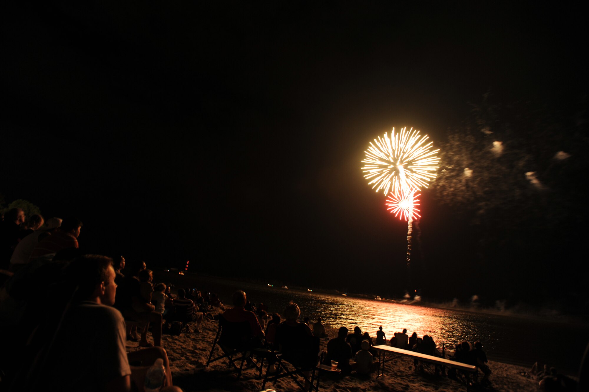 Hurlburt Airmen and families are treated to a dazzling 20-minute fireworks display during the 15th annual Sound of Independence at Hurlburt Field, Fla., July 2, 2010.  The festival, held every year at the Soundside Marina, features a cardboard boat regatta, concessions, and a live DJ that plays music up to and during the fireworks show. (DoD photo by U.S. Air Force Senior Airman Matthew Loken/Released)