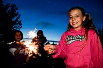 BURLINGTON, N.D. – Rylie Dow, daughter of Tech. Sgt. Thomas Dow, Minot AFB public affairs, celebrates the 4th of July with a sparkler here July 4. Minot’s Airmen and their families enjoyed fun, festivities and fireworks both on- and off-base during the 2010 celebration of our nation’s independence. (U.S. Air Force photo by Tech. Sgt. Thomas Dow)