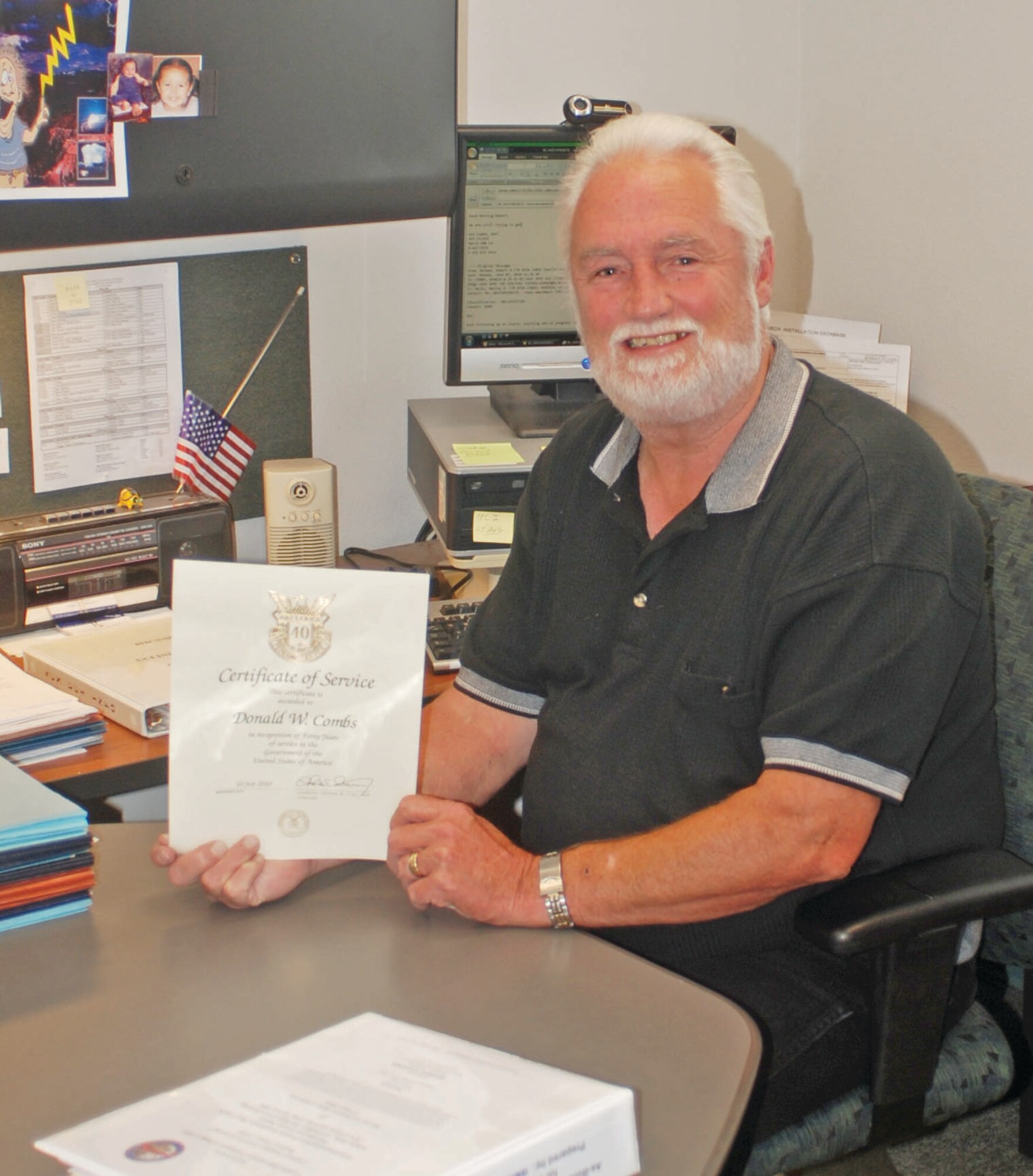 During the civilian commander’s call June 22, Col. Karl McGregor, 452nd Air Mobility Wing commander, presented Mr. Donald Combs with a pin and certificate honoring his 40 years of civil service. Combs enlisted in the Air Force in 1967 as a telephone cable splicer and served in Vietnam in 1968. He later entered civil service and has worked in the field of communications since. 

“We installed base telephone cables all over the world,” he said. In addition to the travel, Combs said he’s most enjoyed the people he’s been able to work with over the years. Combs is the chief of plans and programs at the 452nd Communications Squadron. He said he has no plans for retirement on the horizon. (U.S. Air Force photo by Megan Just)