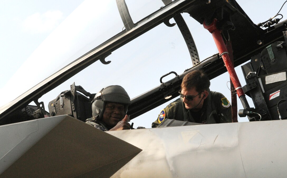 LANGLEY AIR FORCE BASE, Va. – U.S. Army Col. Reggie Austin, 633d Air Base Wing vice commander, receives an F-15C Eagle orientation flight from U.S. Air Force Capt. Justin Eagan, 71st Fighter Squadron pilot, June 22.  Colonel Austin took the opportunity to familiarize himself with the aircraft and it’s unique capabilities as the Air Force and Army join forces under Joint Base Langley-Eustis.  (U.S. Air Force photo/ Senior Airman Dana Hill)

