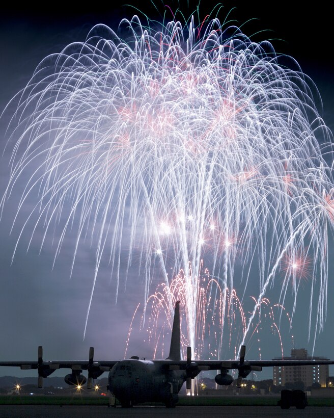 Fireworks burst over Yokota Air Base, Japan, July 3, 2010. Members of the 374th Force Support Squadron started the day with the Firecracker 5K run and continued with a wide variety of activities throughout the day including go-carts, a petting zoo, live entertainment, food and fireworks. (U.S. Air Force photo/Osakabe Yasuo)