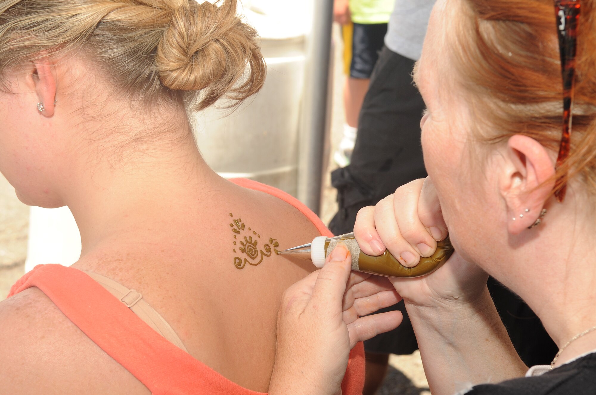 BUCKLEY AIR FORCE BASE, Colo. -- Henna Tattoos were given out at Freedom Fest July 1, one of the many free activities offered during the event. (U.S. Air Force Photo by Airman 1st Class Manisha Vasquez) 