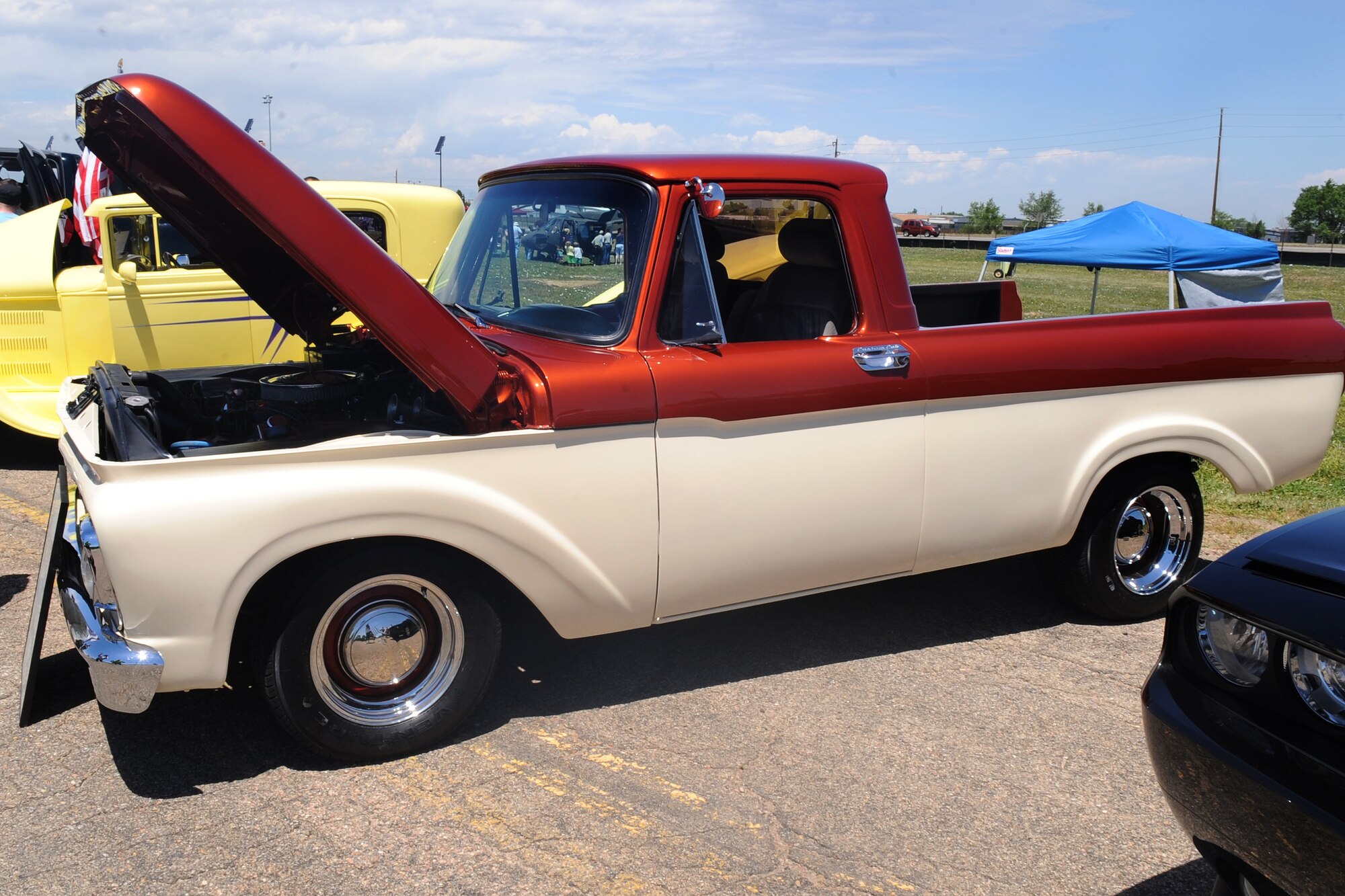 BUCKLEY AIR FORCE BASE, Colo.-- Classic cars, new cars and sports cars all sit out on display at Freedom Fest July 1. Each car was judged and graded for a grand prize to be awarded to the owner of the vehicle. (U.S. Air Force Photo by Airman 1st Class Manisha Vasquez) 