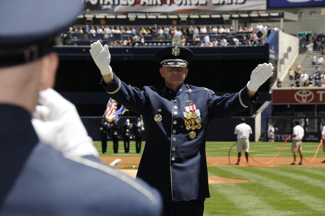 Lt. Col. A. Phillip Waite, U.S. Air Force Band conductor, conducts the Ceremonial Brass July 2 at Yankees Stadium in New York City. The Ceremonial Brass performed the American and Canadian national anthems in honor of the New York Yankees going up against the Toronto Blue Jays. (Airman 1st Class Susan Moreno)