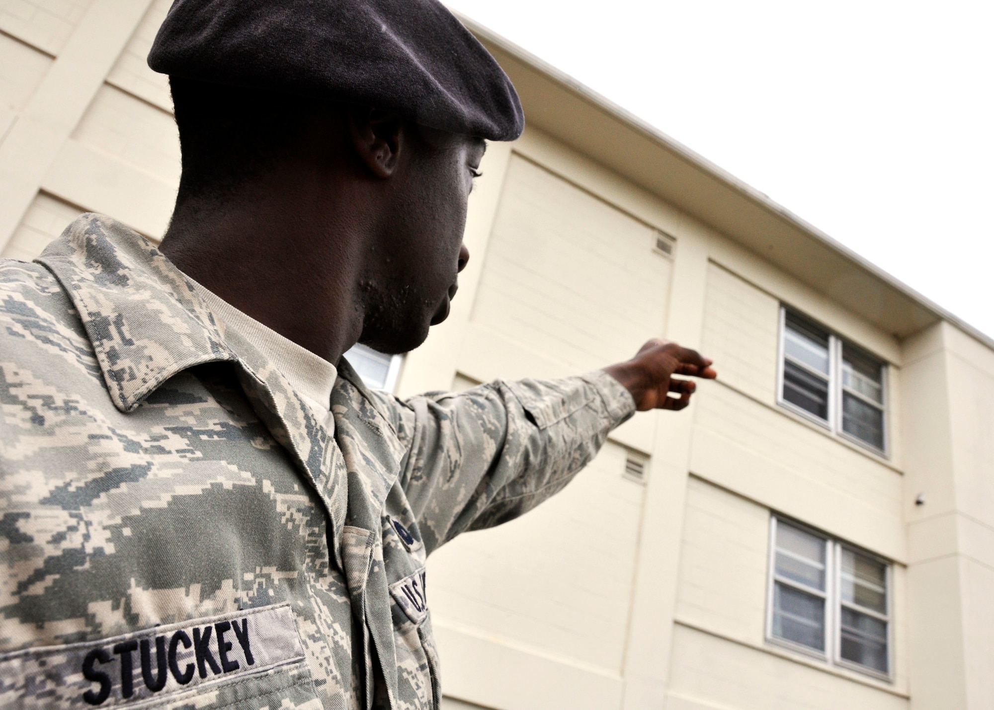 Senior Airman Isaac Stuckey, 96th Security Forces Squadron,  points out his old dorm room prior to beginning the demolition of Dorm 17, the last of the old dorms along Eglin Boulevard, July 6.  Airman Stuckey spent eight months in the “old” dorms before deploying.  He also lived in the new quad-style dorms as well and said they were “much better.”  According to 96th Civil Engineer Group, the dorm will be completely leveled and cleaned up in eight weeks.  All of the concrete within the structure will be recycled.  (U.S. Air Force photo/Samuel King Jr.)