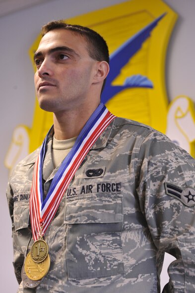 Airman 1st Class Geanny Hernandez Quiala, 436th Aerial Port Squadron, displays his medals at the 436th Airlift Wing Headquarters building Dover Air Force Base, Del. June 30, 2010. Airman Hernandez Quiala won the awards in recent Jujitsu competitions. He will be representing the U.S. in the Pan-American Games, World Cup and the World Championships later this year.  (U.S. Air Force photo by Airman 1st Class Shenchia Chu/Released)