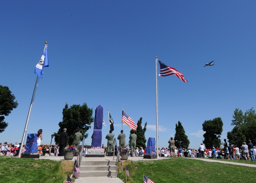 A C-130 from the Niagara Falls Air Reserve Station executes a flyover during the Dedication of the City of Tonawanda All Heroes’ Memorial July 3, 2010, Tonawanda NY. This new memorial was dedicated to all natives of the City of Tonawanda who had given their lives in service to their country. (U.S. Air Force photo by Staff Sgt. Joseph McKee)