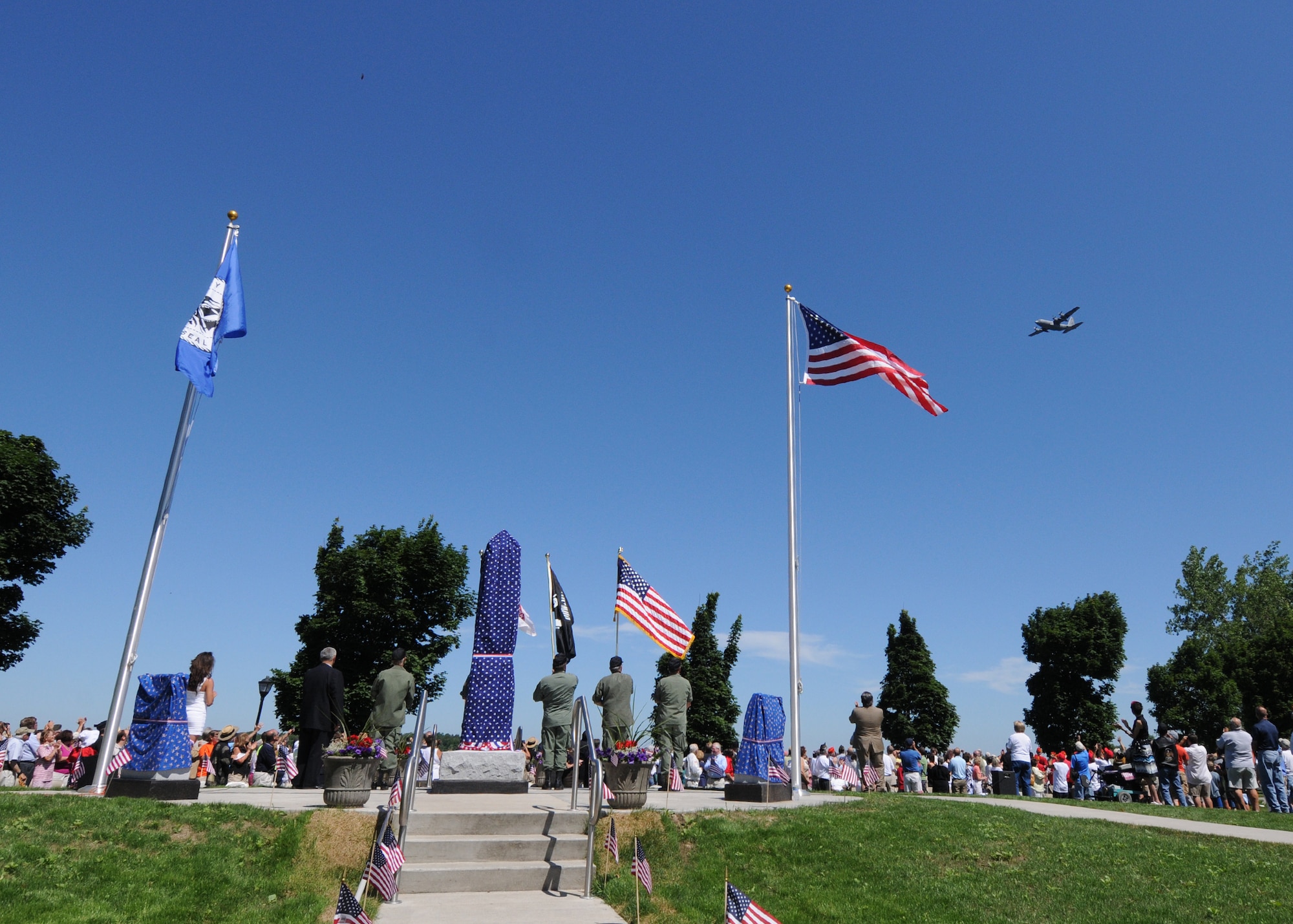 A C-130 from the Niagara Falls Air Reserve Station executes a flyover during the Dedication of the City of Tonawanda All Heroes’ Memorial July 3, 2010, Tonawanda NY. This new memorial was dedicated to all natives of the City of Tonawanda who had given their lives in service to their country. (U.S. Air Force photo by Staff Sgt. Joseph McKee)